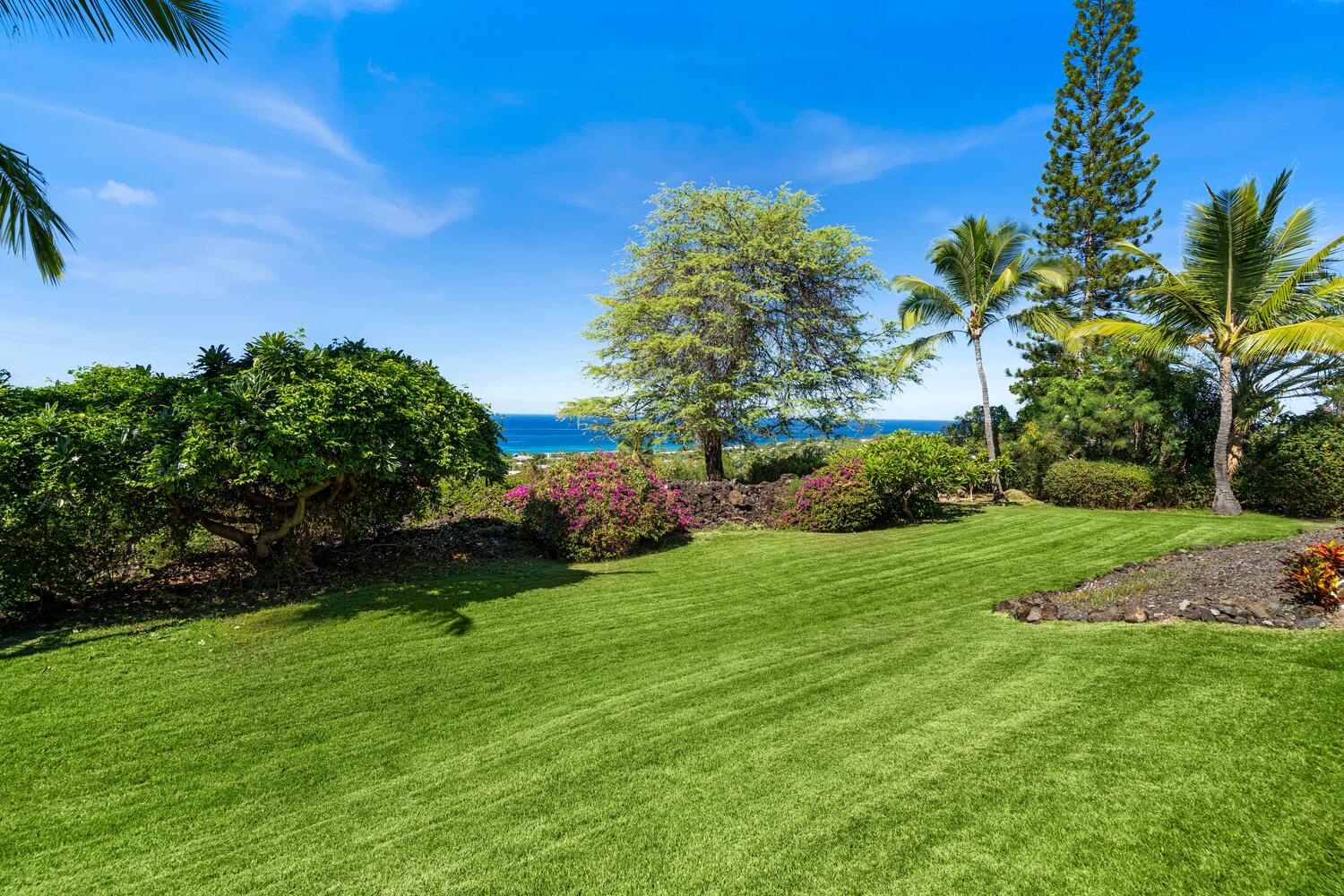 Kailua Kona Vacation Rentals, Ho'okipa Hale - Lush greenery in the backyard offers space to play, unwind, and connect with nature.
