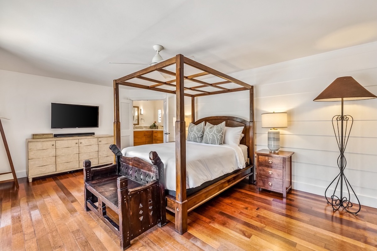 Kailua Vacation Rentals, Hale Ohana - The primary bedroom has a queen bed and garden and pool views.