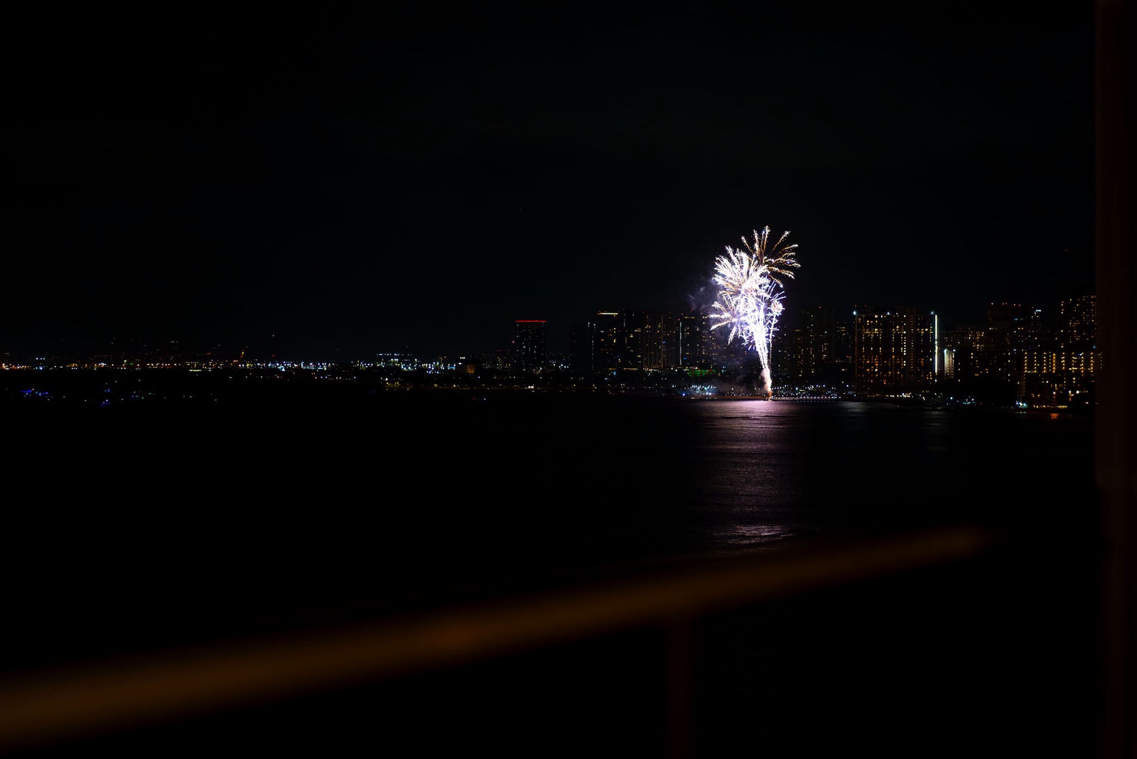 Honolulu Vacation Rentals, Hale Kaimana - Spectacular fireworks show offering a mesmerizing view against the city skyline backdrop.