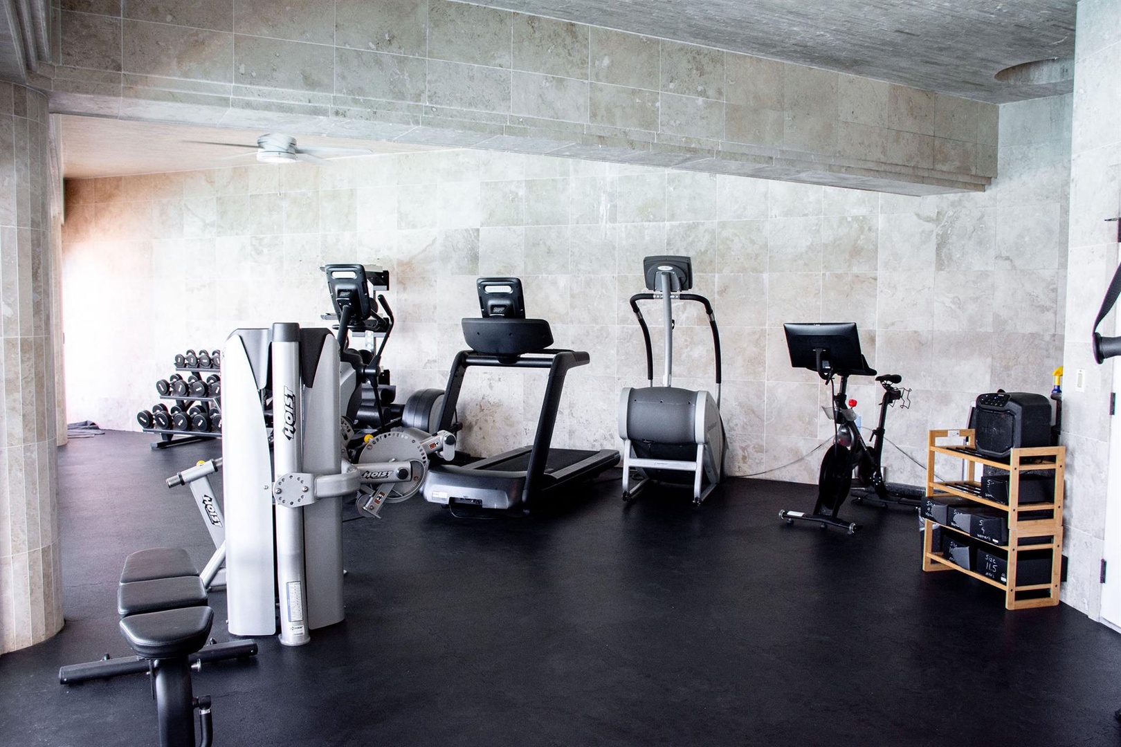 Ninole Vacation Rentals, Waterfalling Estate** - Stay active in the home's private gym, equipped with modern fitness machines and weights, perfect for a quick workout without leaving the comfort of your vacation retreat.