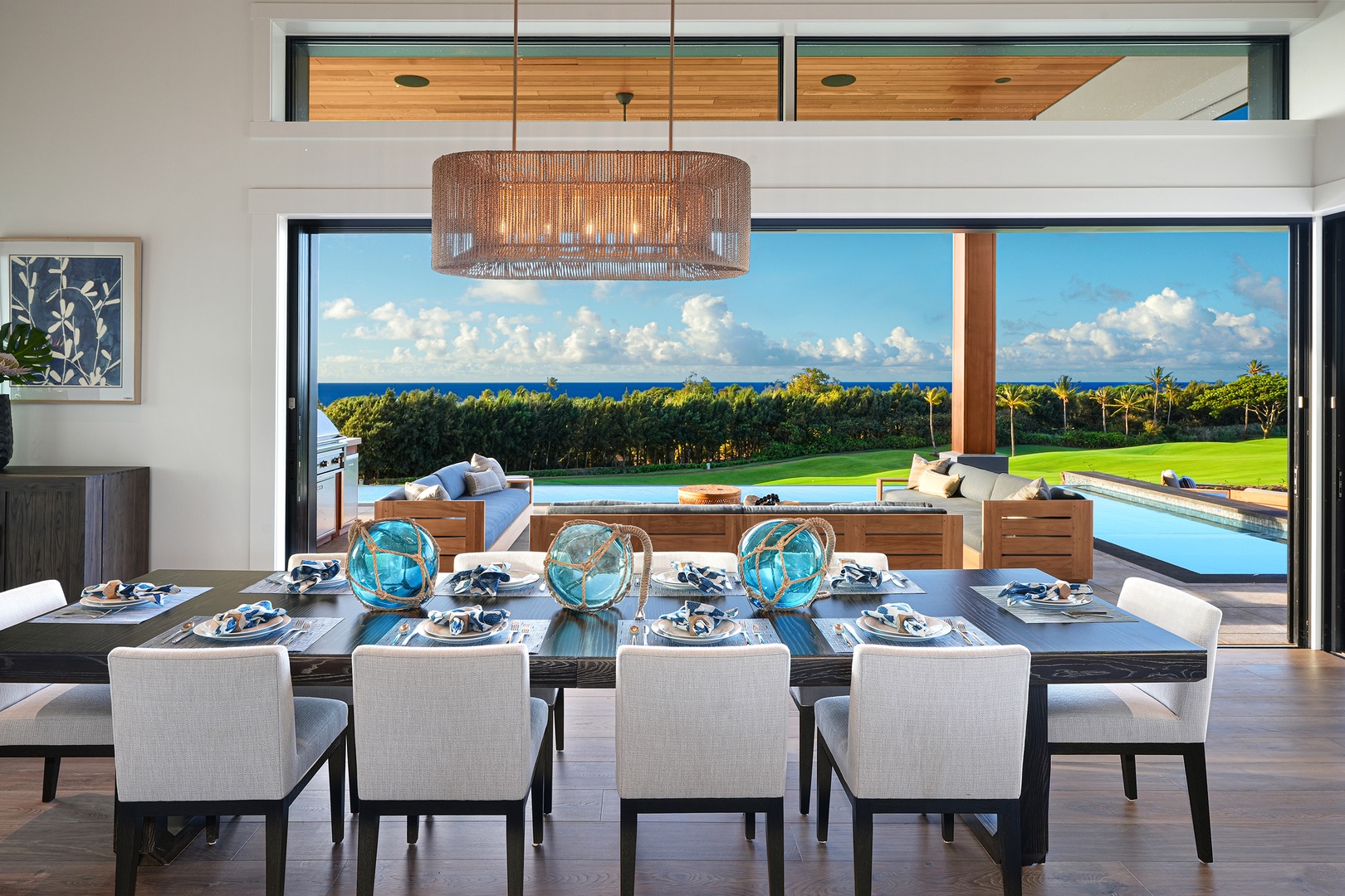 Koloa Vacation Rentals, Ke Kai Nui at Kukuiula - Gather around in an elegant dining space with expansive windows showcasing ocean views.