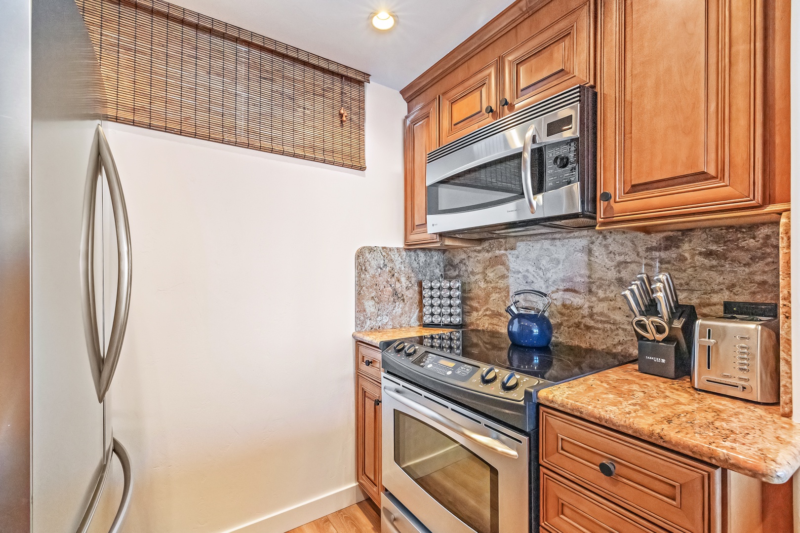 Lahaina Vacation Rentals, Mahana 1118 - The well-equipped kitchen features modern appliances and granite countertops, making meal prep easy and enjoyable