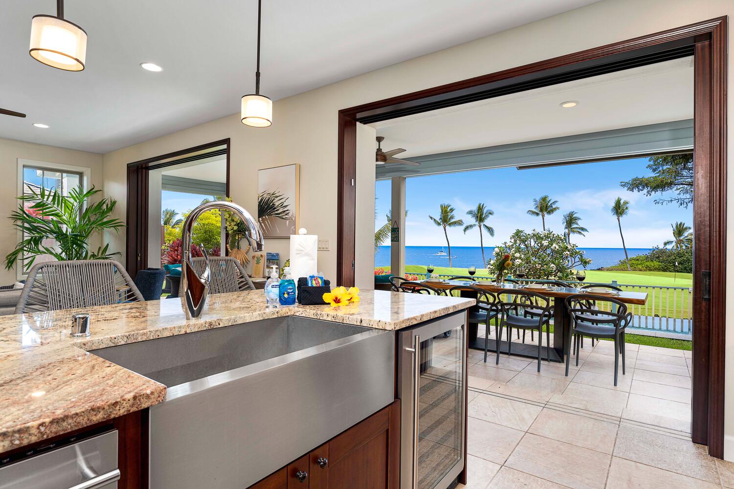 Kailua-Kona Vacation Rentals, Holua Kai #26 - Kitchen with a seamless transition to an oceanfront patio, perfect for entertaining.
