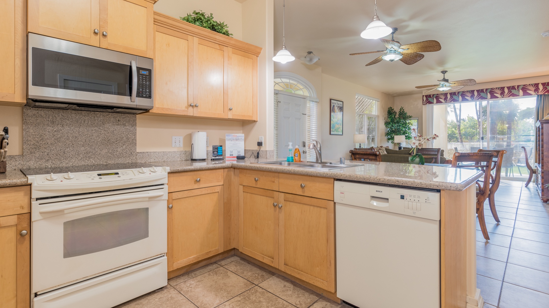 Kapolei Vacation Rentals, Kai Lani 8B - The bright kitchen features many amenities including a fridge, oven, spacious counter tops and high ceilings.