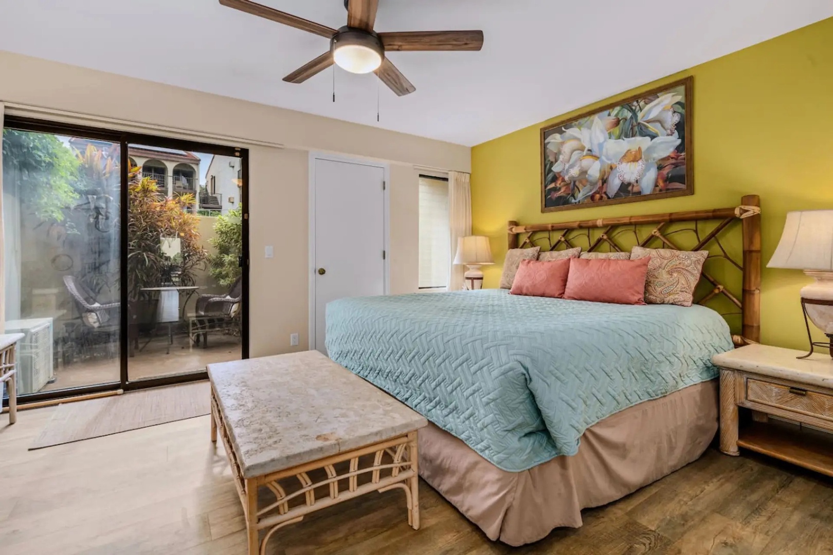 Kihei Vacation Rentals, Maui Kamaole E103 - The primary suite opens straight onto its own lanai, just past the sliding door.