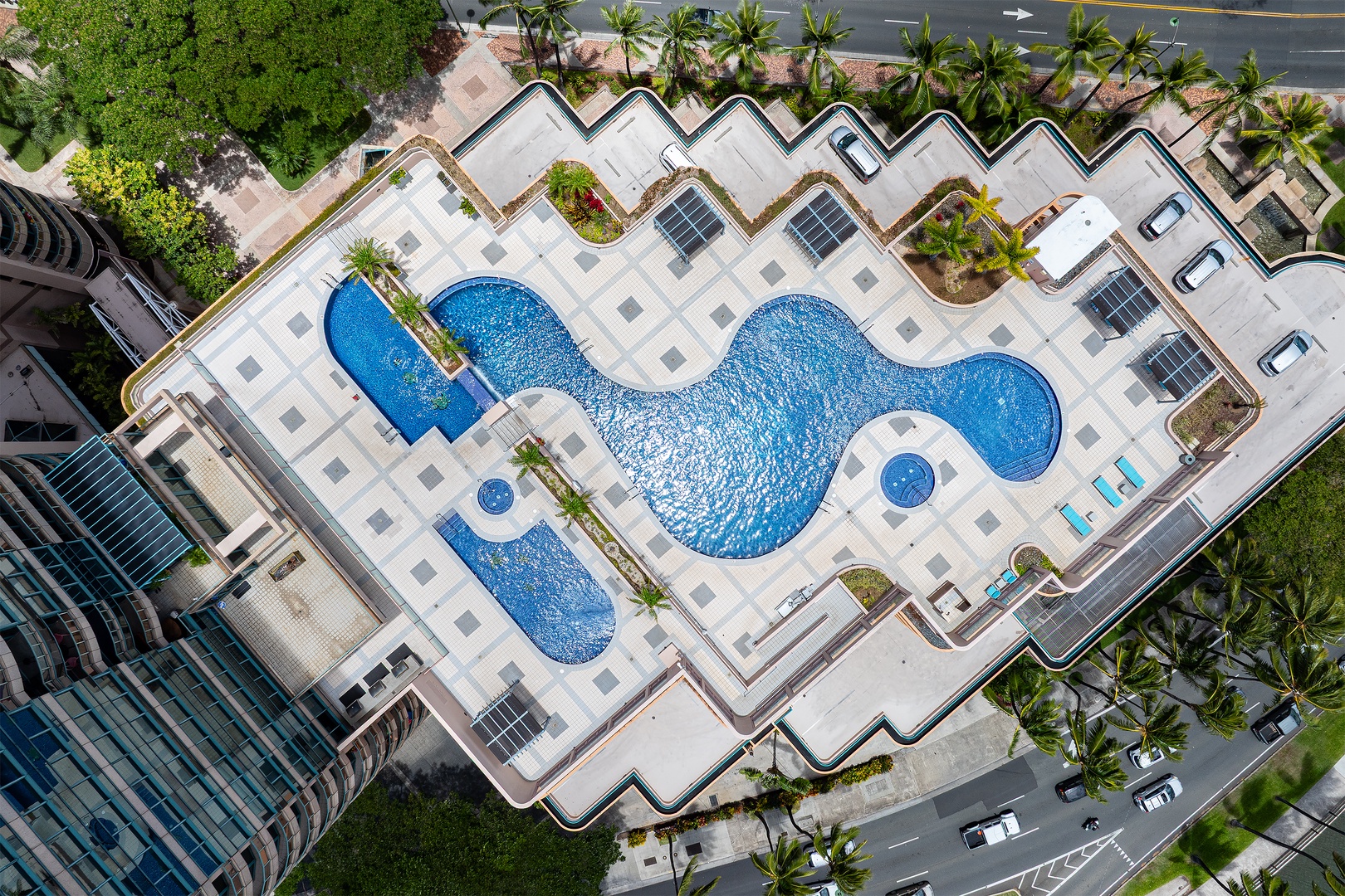 Honolulu Vacation Rentals, Island View at Waikiki Landmark - From above, the pool traces one long curve across the open deck high over the city.