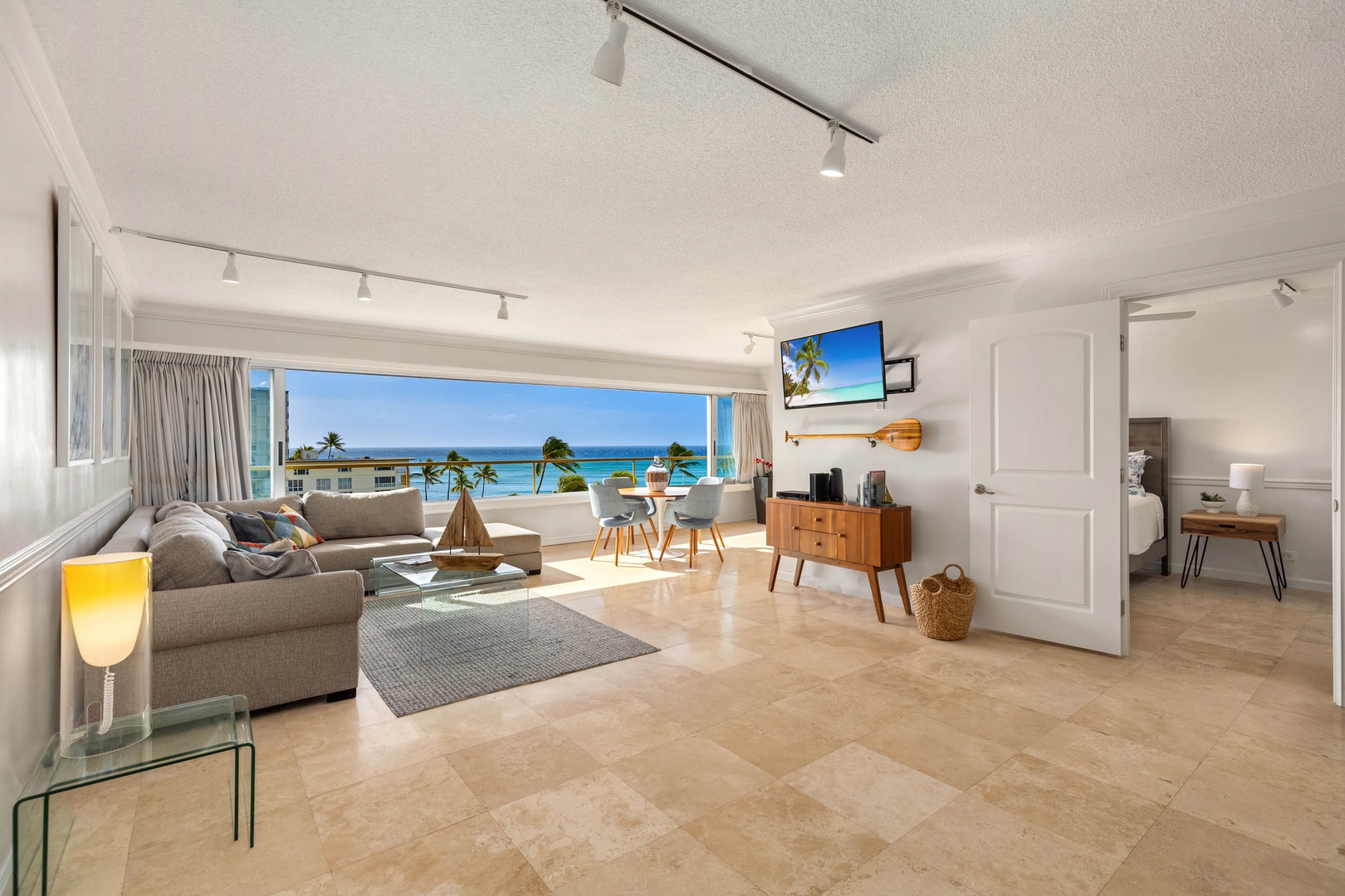 Honolulu Vacation Rentals, Colony Surf Getaway - Spacious and modern living area with seamless indoor-outdoor flow for a tranquil retreat.