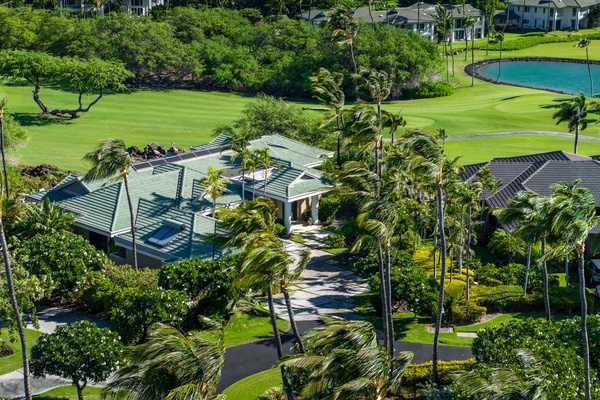 Kamuela Vacation Rentals, Champion Ridge 22 & 24 - Aerial view of Champion Ridge 24, a beautiful tropical home nestled among palm trees and greenery.