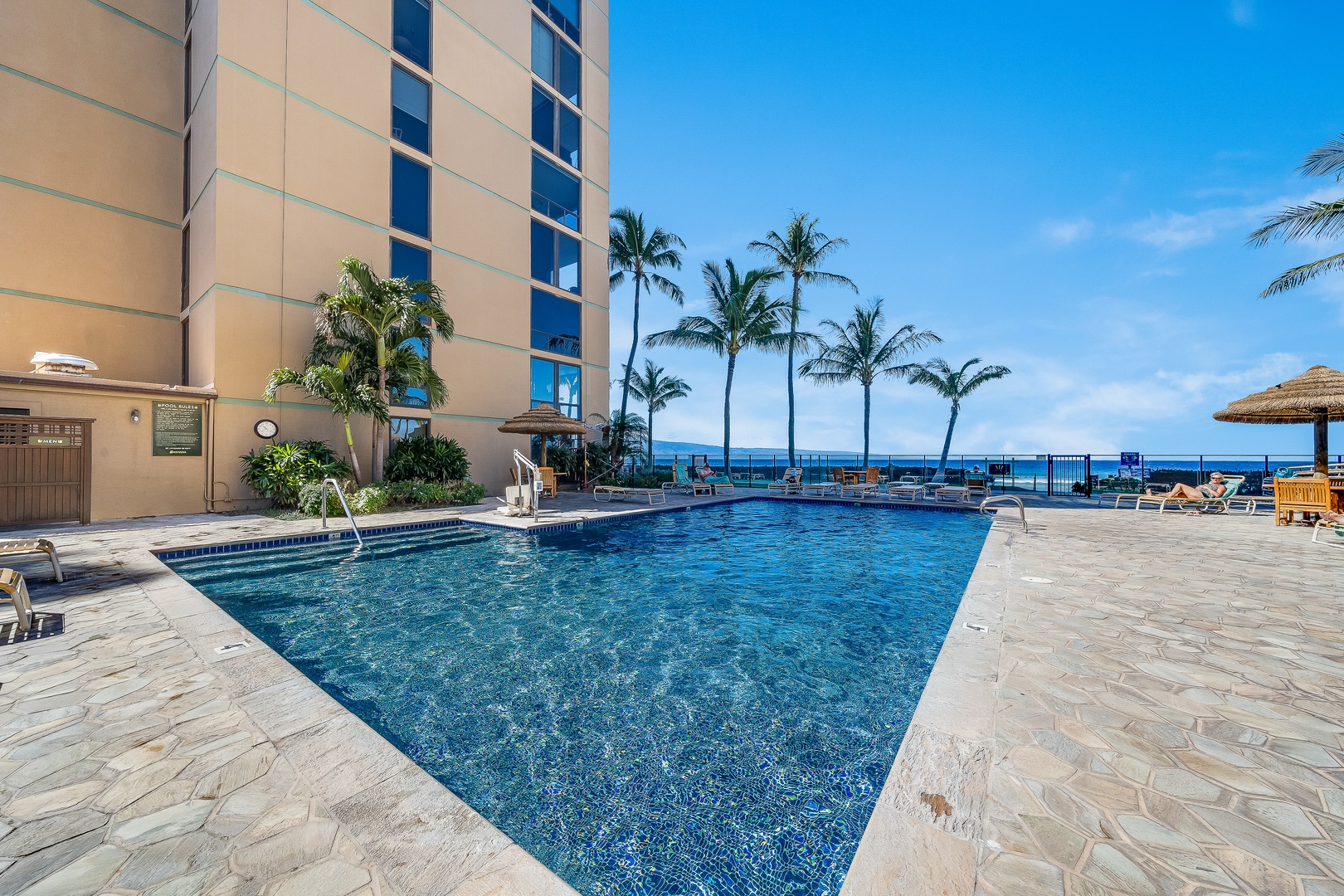 Lahaina Vacation Rentals, Mahana 1118 - Lounge by the oceanfront pool at Mahana 1118 with views of the sparkling Pacific.