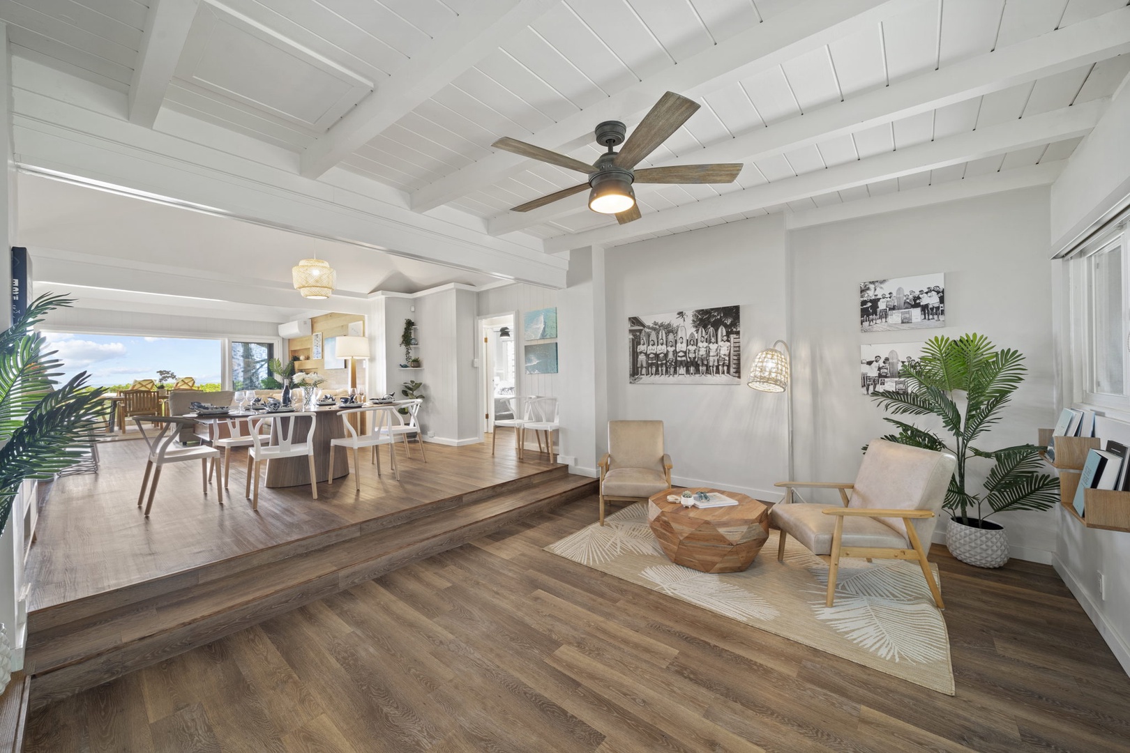 Haleiwa Vacation Rentals, Hale Nalu (Lower Level) - Bright and inviting living room with wood flooring, ceiling fan, and cozy island-inspired decor.