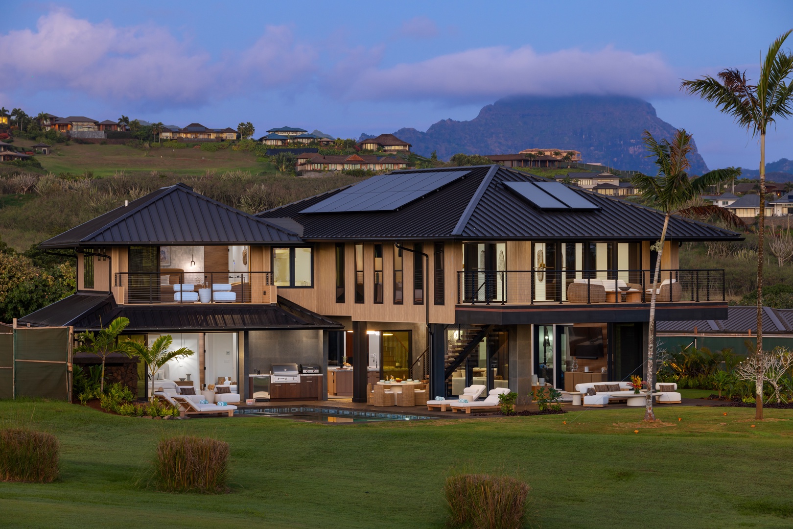 Koloa Vacation Rentals, Hale o ka Nene - The estate transforms at twilight into a glowing retreat, inviting evening swims and moonlit conversations.
