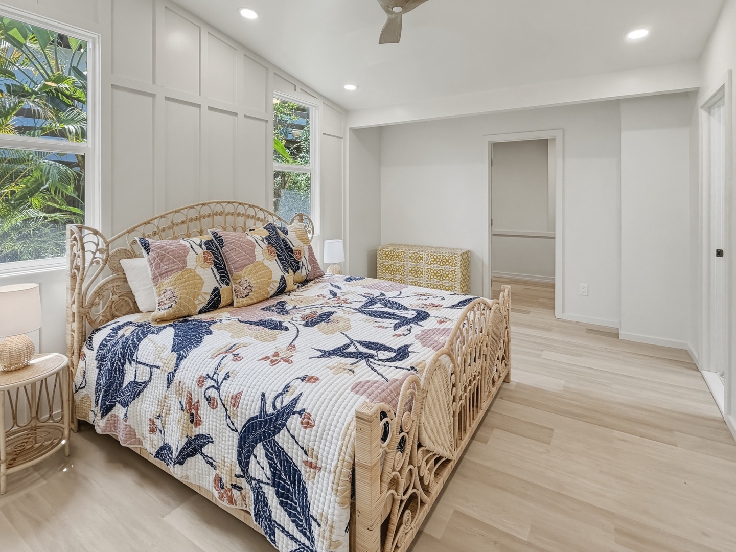 Kailua Vacation Rentals, Kai Nalu - Wake up in your tropical-inspired bedroom, where the botanical quilt and rattan bed frame create a serene coastal vibe.