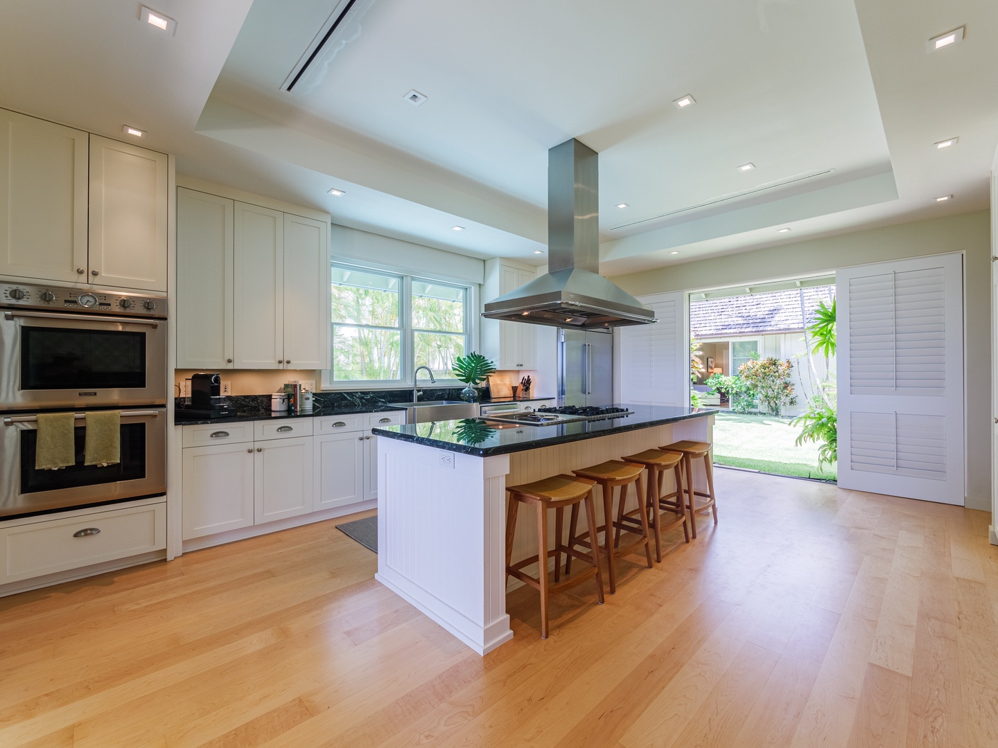Honolulu Vacation Rentals, Paradise Beach Estate - Dive into culinary adventures in our spacious kitchen area, where ample space meets modern functionality for all your cooking endeavors.
