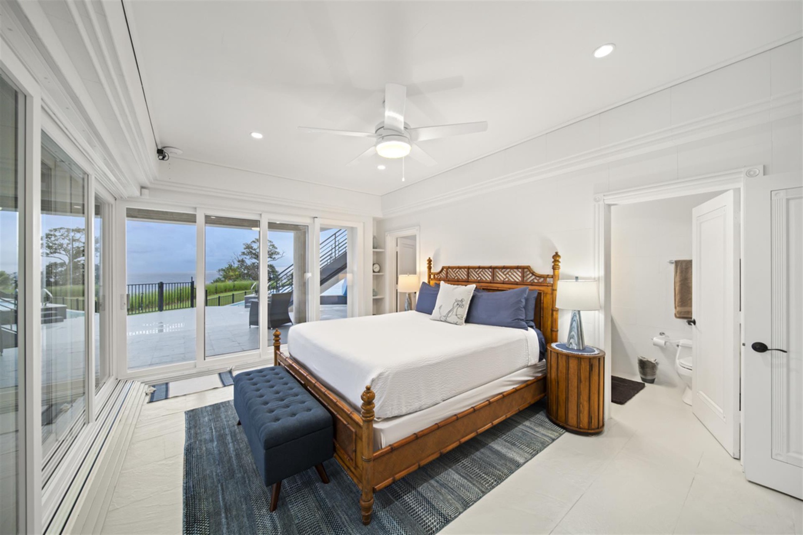 Ninole Vacation Rentals, Waterfalling Estate** - Guest Room #4 (1st floor) w/king bed, panoramic ocean views & full en suite bath.