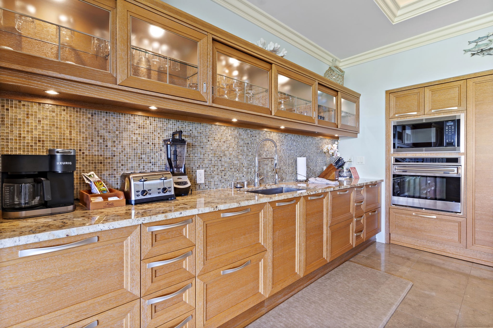 Wailea Vacation Rentals, Wailea Luxury Residence Hoolei 93-3 - Sleek and stylish, the kitchen at Wailea Hoolei 93-3 features granite, custom cabinetry, and luxe appliances.