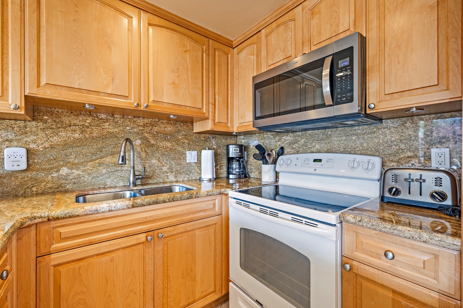 Lahaina Vacation Rentals, Papakea G-306 - The kitchen is equipped with modern appliances, including a full-size oven and microwave, making it easy to prepare home-cooked meals during your stay.