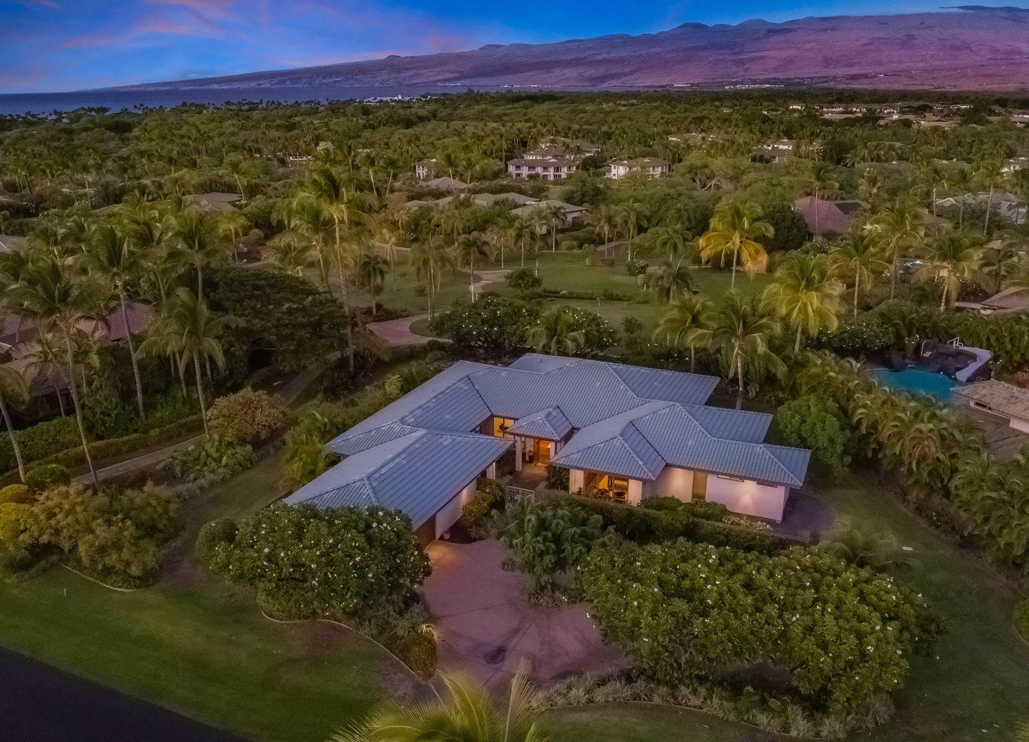 Kamuela Vacation Rentals, Champion Ridge Oasis - Aerial view of the stunning estate surrounded by tropical greenery and spectacular view of the Kohala Mountains.