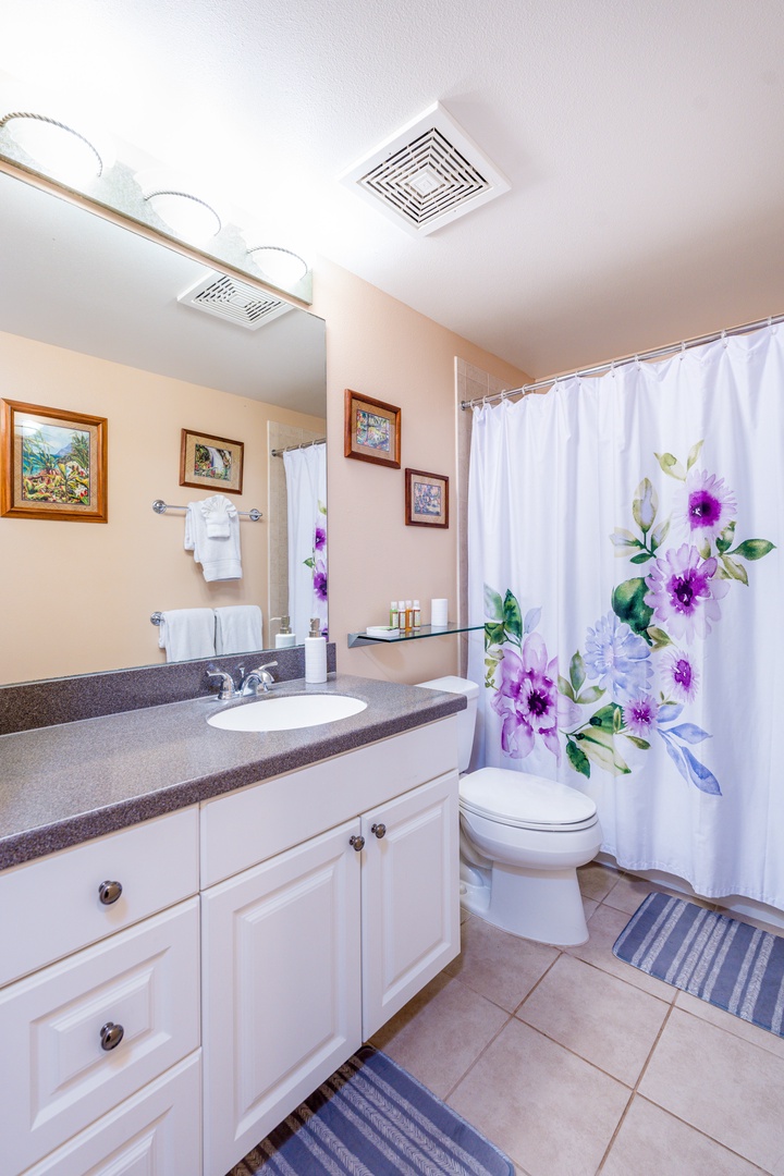 Kapolei Vacation Rentals, Ko Olina Kai 1081C - The guest bathroom with a shower.