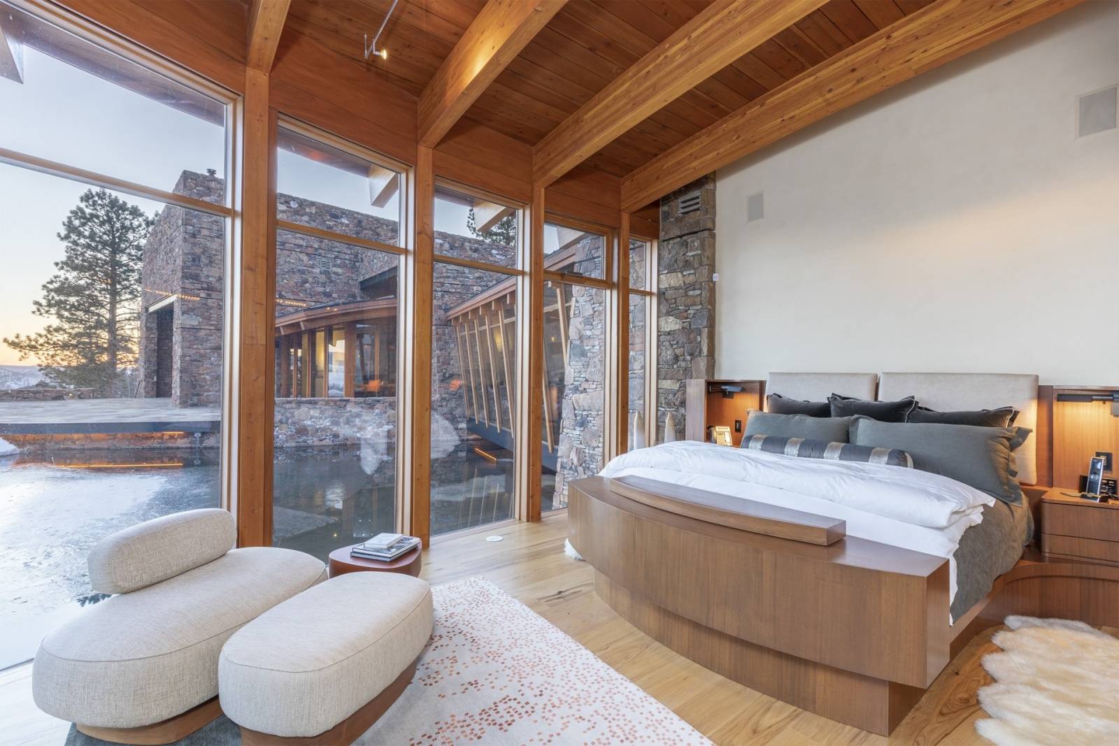 Telluride Vacation Rentals, PaGomo* - Walk across the private bridge to the East Pod to the main master bedroom which basks in the natural sunlight with panoramic views of the majestic San Juan Mountains and trout pond underway.