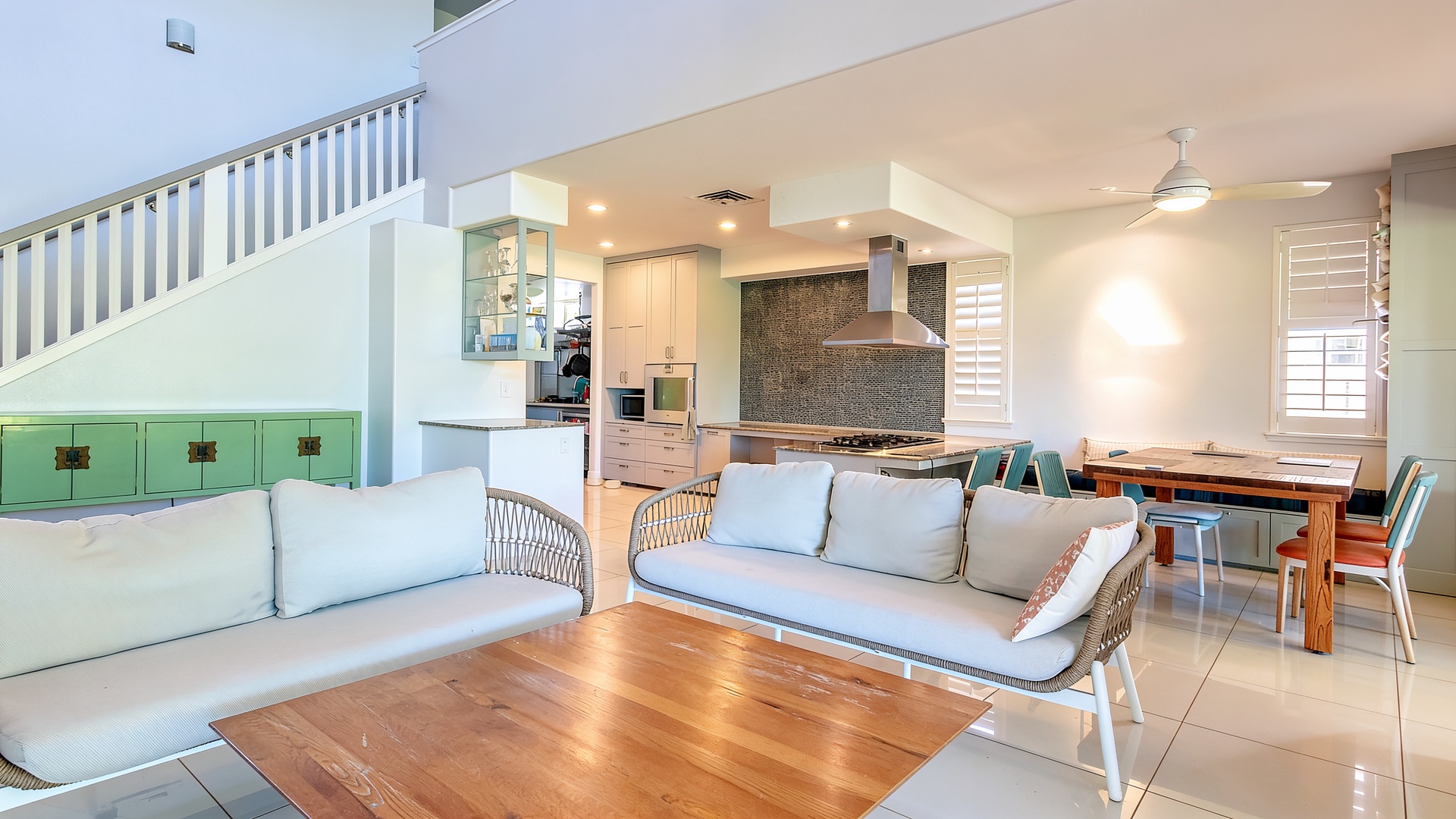 Ceilings climb to the second floor, so the living room feels open and full of light.