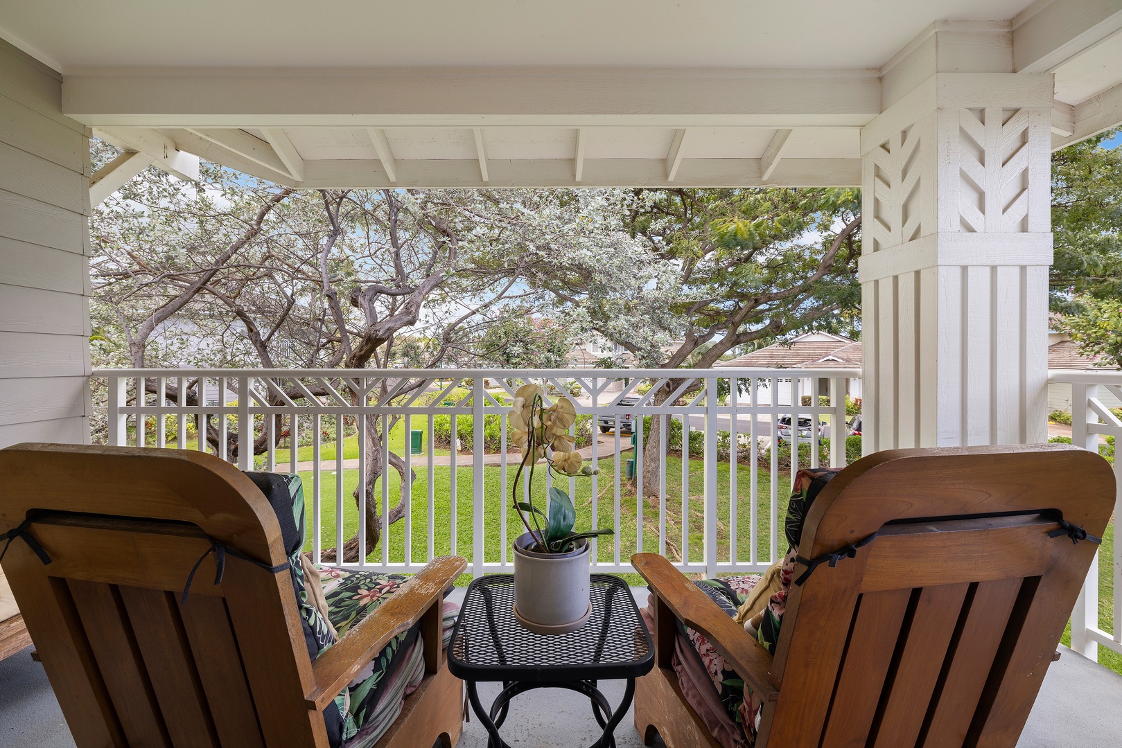 Kapolei Vacation Rentals, Ko Olina Kai 1105E - Settle into your private balcony, where lush garden views and peaceful shade invite you to relax with morning coffee or a good book in hand.