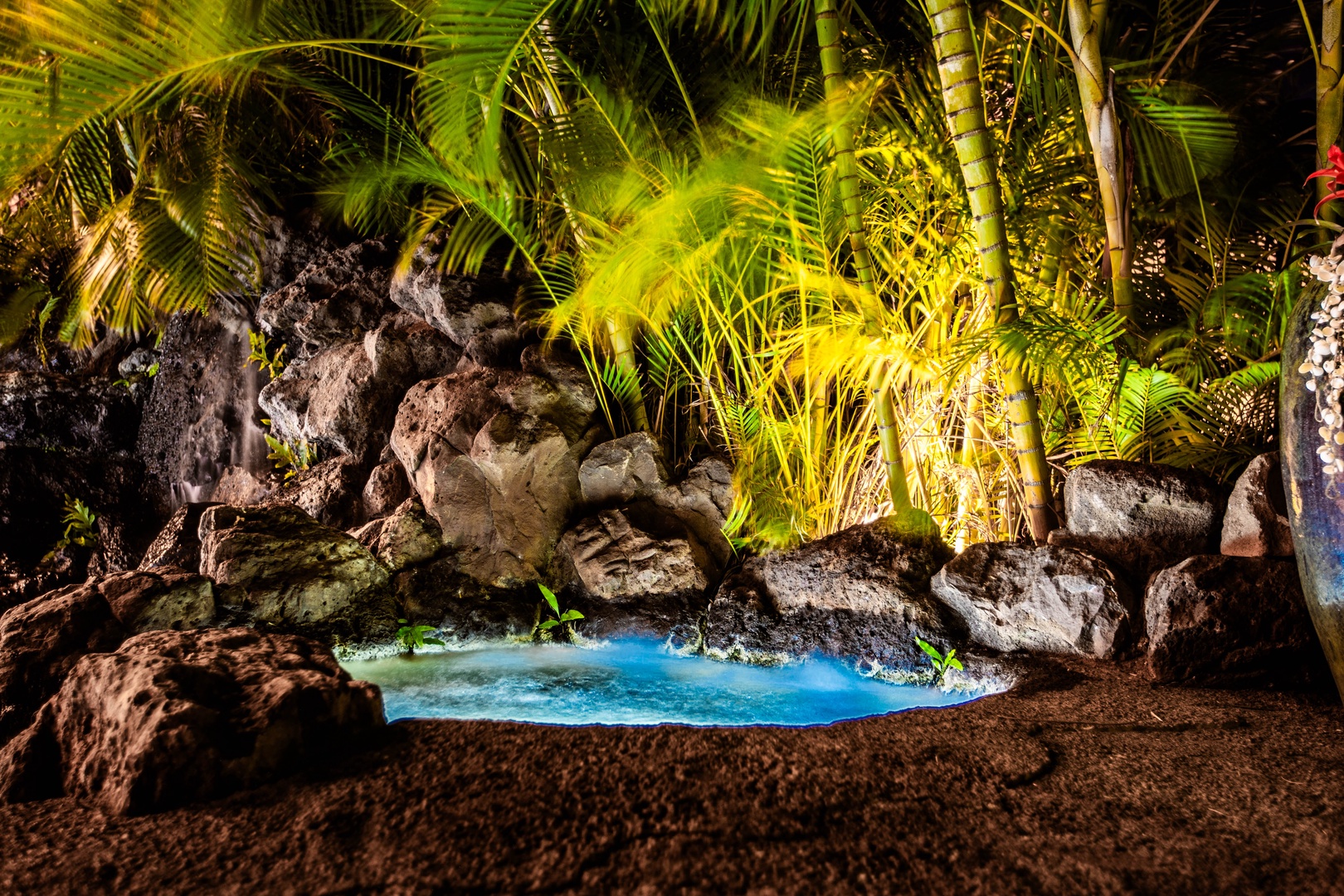Honolulu Vacation Rentals, Pili Pono - Hidden spa nestled into rocks under glowing garden lights.