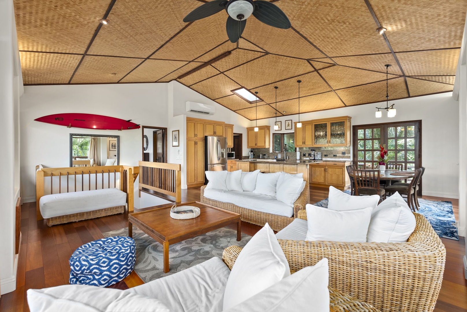 Haleiwa Vacation Rentals, Kealoha Tropical Beach Villa - Enjoy the spacious, open-concept floorplan, perfect for relaxing and entertaining with comfortable wicker seating and a seamless flow from the kitchen to the living area.