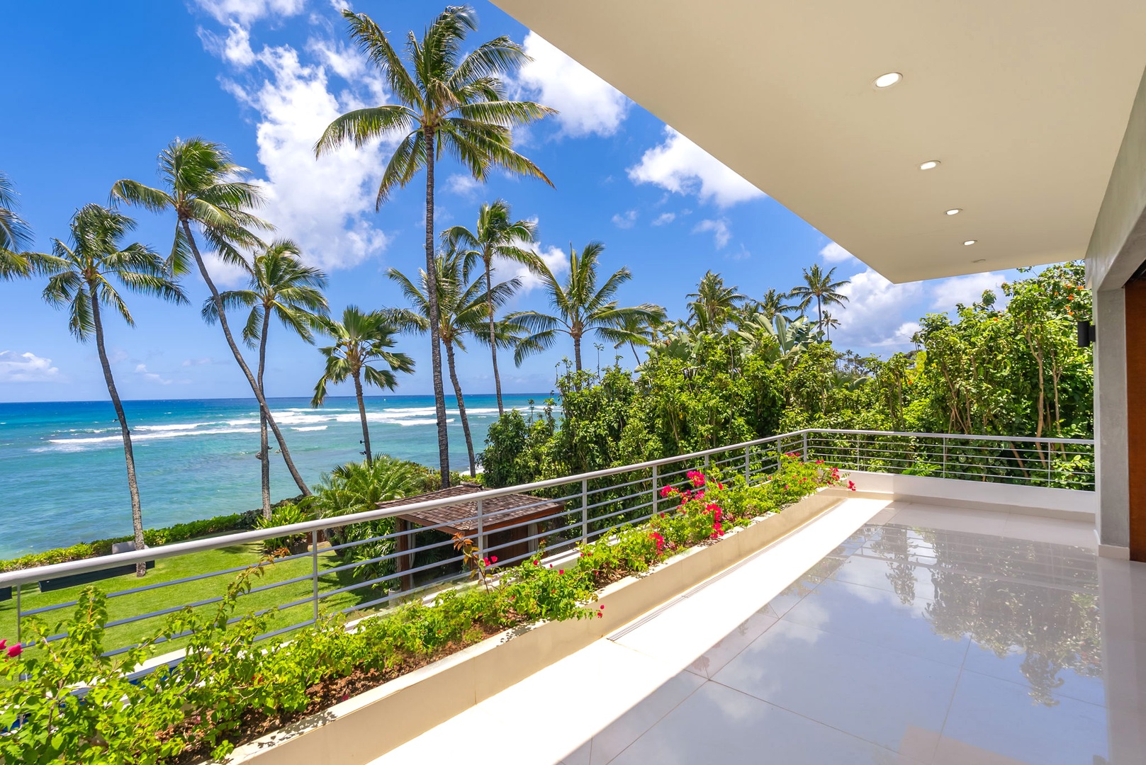 Honolulu Vacation Rentals, Diamond Head Beachfront Estate - Step onto your private covered terrace overlooking turquoise waters, swaying palms, and vibrant tropical gardens—a peaceful retreat where ocean views meet island serenity.