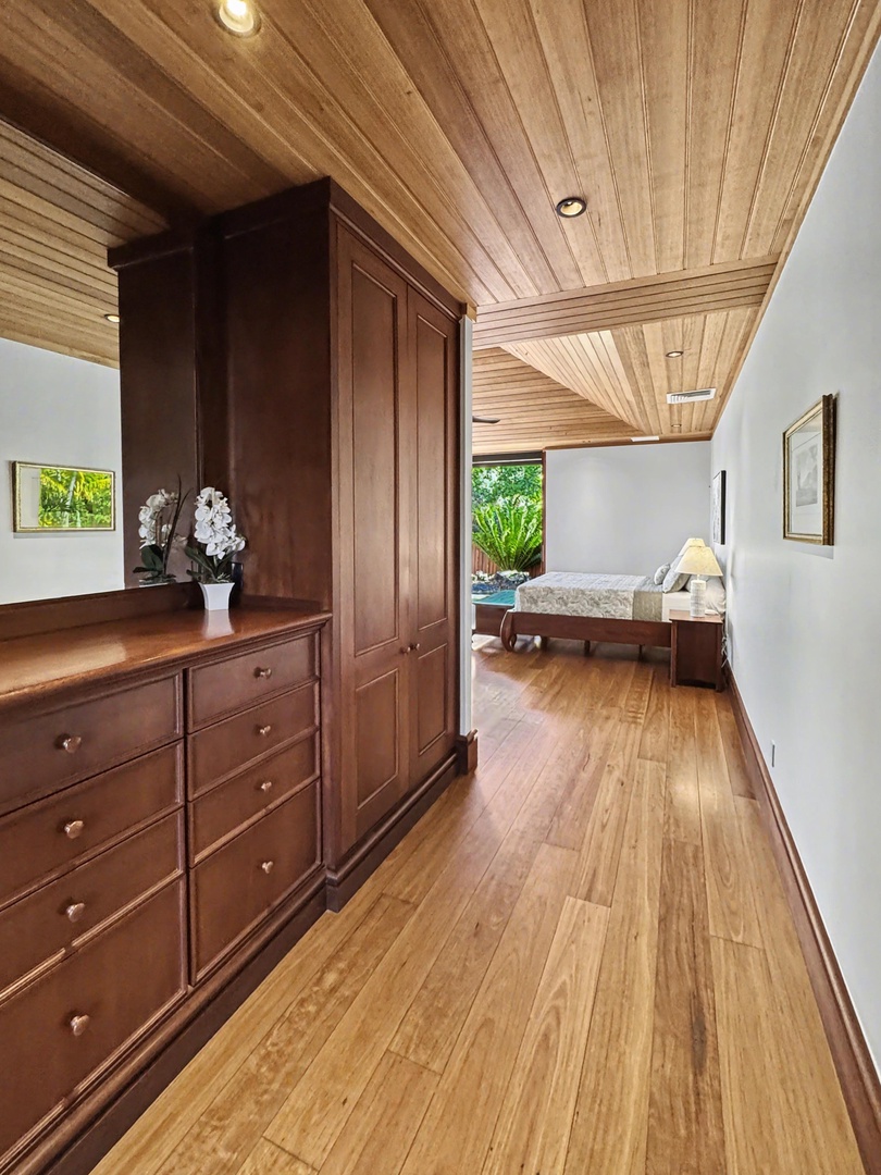 Kailua-Kona Vacation Rentals, Hahalua Bay Villa - Warm wood floors lead you through this stunning bedroom suite with handcrafted built-ins and soaring natural wood ceilings.