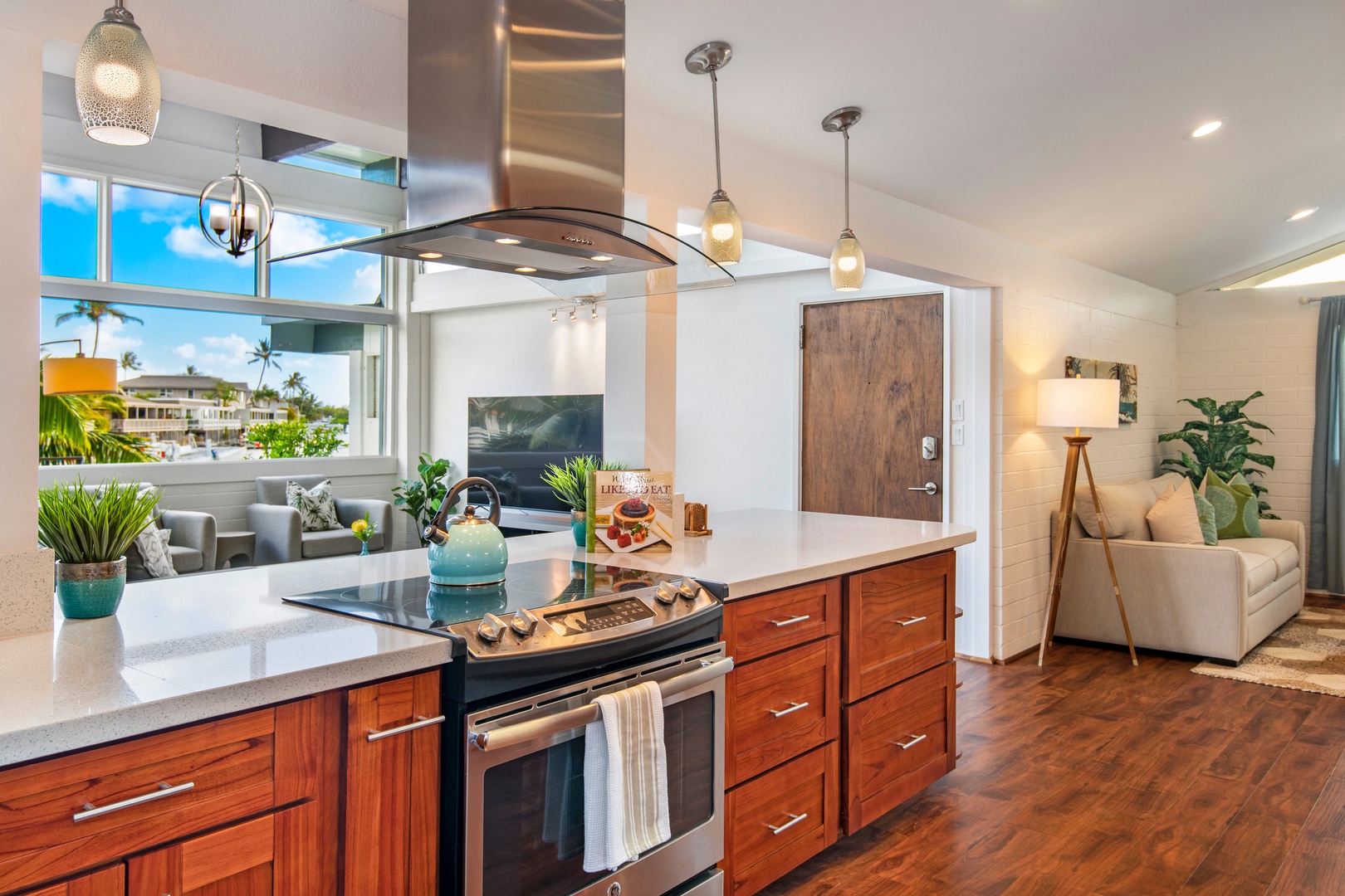 Honolulu Vacation Rentals, Holoholo Hale - Kitchen views into the living room (left) and front entry (right)