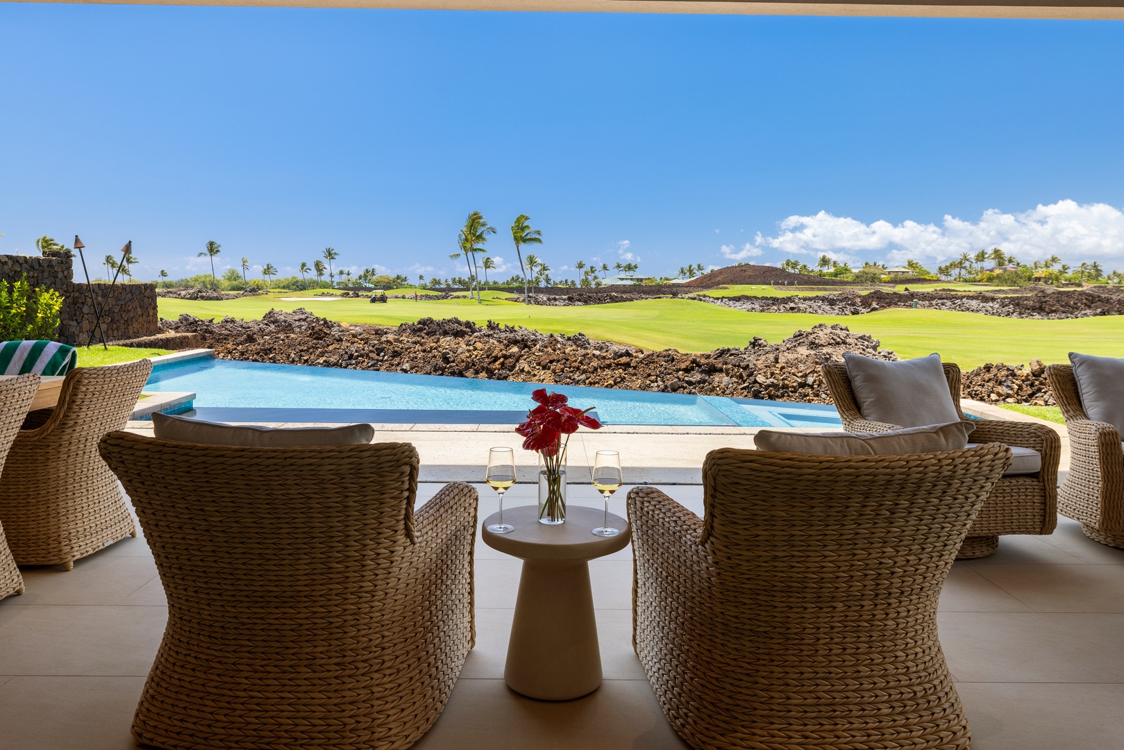 Kamuela Vacation Rentals, 6BD Mauna Lani Lux Golf Estate (5) at One Ocean - Unwind from the lanai with peaceful views of the pool and fairway beyond.
