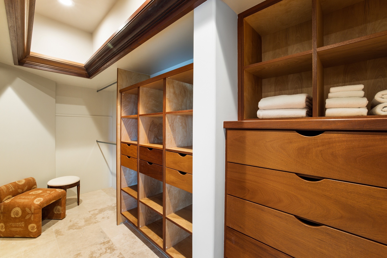 Kamuela Vacation Rentals, Champion Ridge 7 - Generous walk-in closet with custom wood cabinetry offers resort-worthy storage and style.