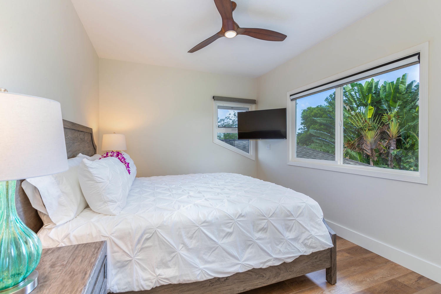 Princeville Vacation Rentals, Pohaku Villa - The upstairs third guest bedroom has flat-screen TV and garden views.