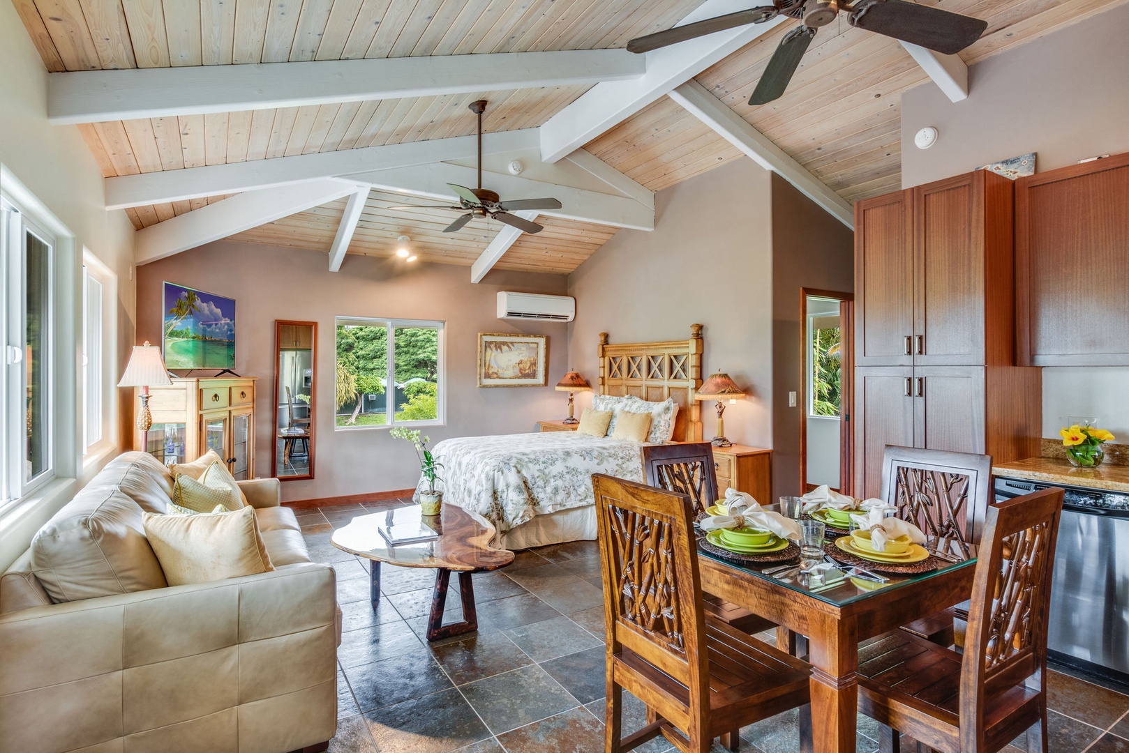 Kailua Kona Vacation Rentals, Kona Beach Bungalows** - Experience tranquility and comfort in the Hoku suite, complete with a cozy lounge and intimate dinette.
