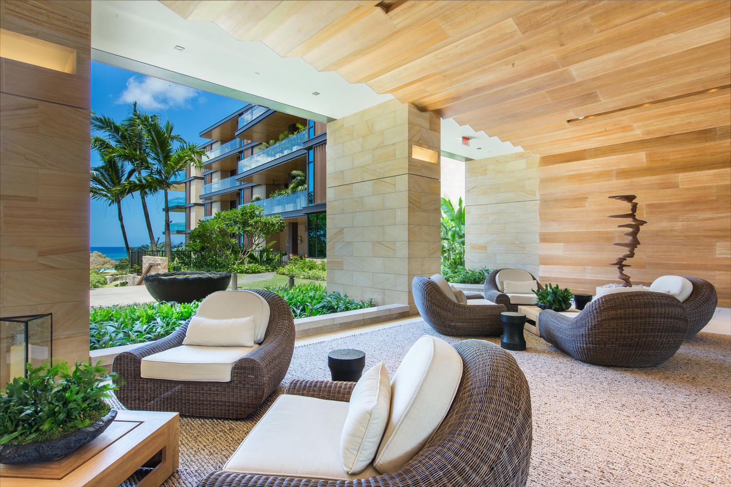 Honolulu Vacation Rentals, Park Lane Sunset Resort - Unwind in this sophisticated lounge where natural wood and stone create your tranquil retreat, with tropical gardens just beyond the windows.