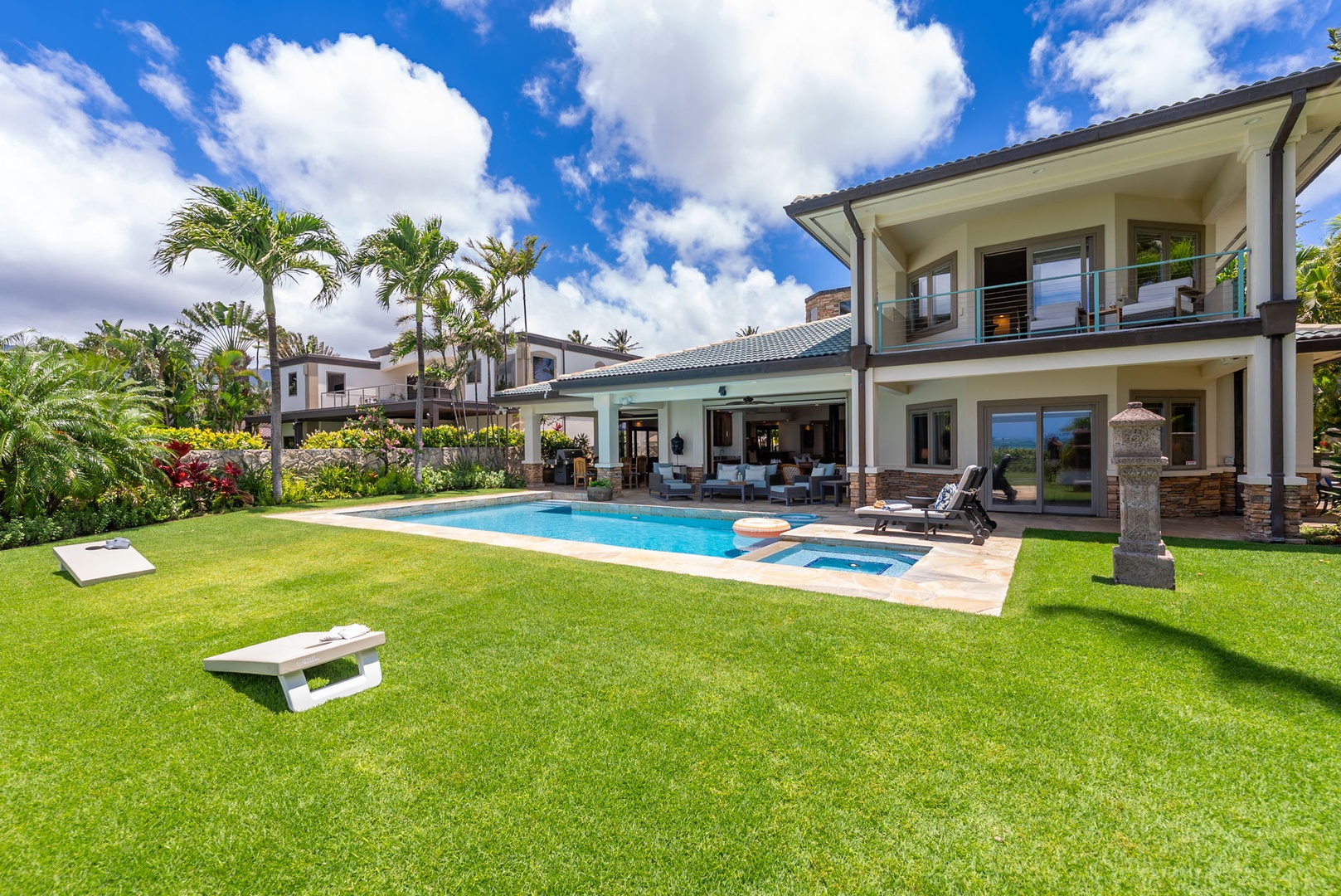 Honolulu Vacation Rentals, Maunalua Estate - A private pool, lush lawn, and swaying palms create a peaceful oceanfront retreat.
