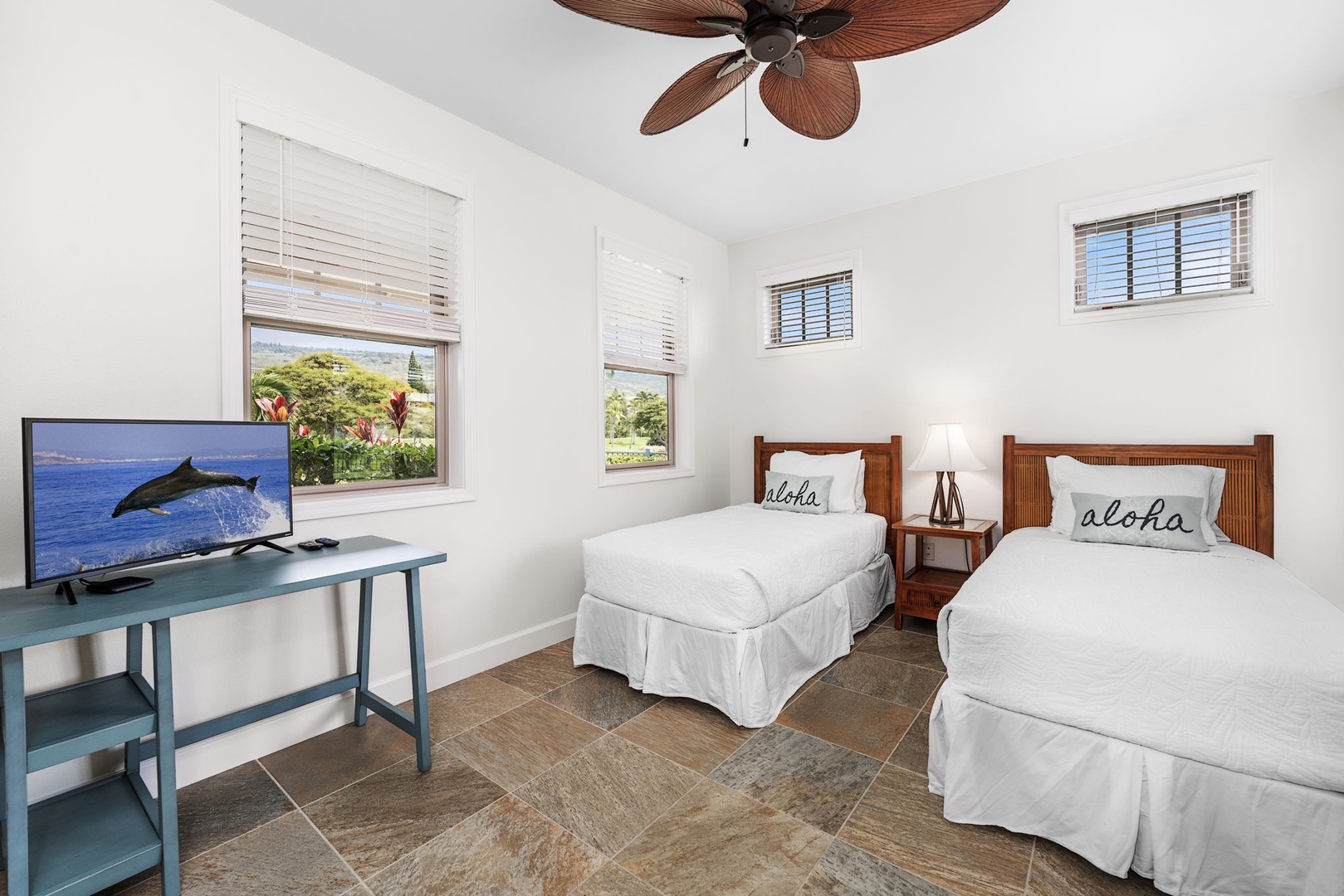 Kailua Kona Vacation Rentals, Holua Moana Hale - Comfortable guest bedroom with two twin beds and workspace for remote work.