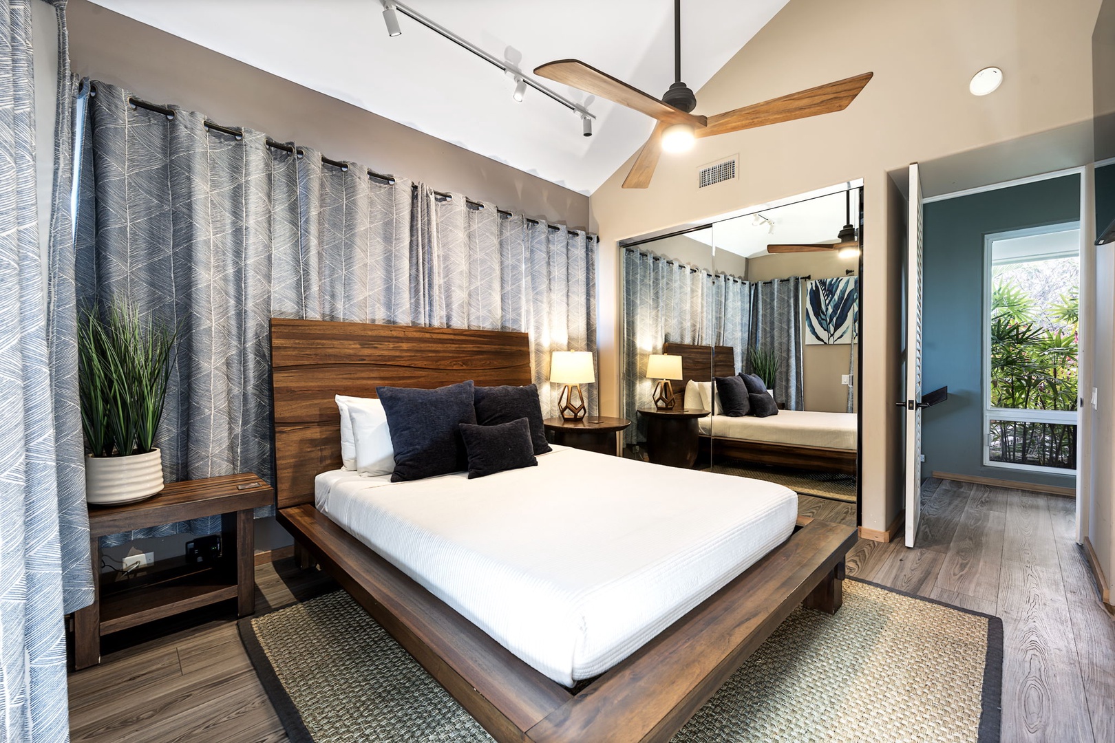 Kailua Kona Vacation Rentals, Hale Nai'a - Sleep peacefully in this modern sanctuary with rich wood furnishings, ceiling fan, and private balcony access.