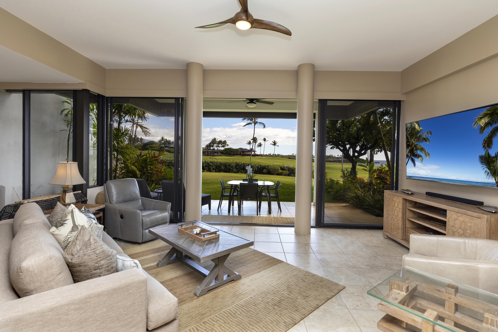 Kamuela Vacation Rentals, Mauna Lani Point E105 - Take in tropical views and step directly onto the lanai from the comfort of the living room.
