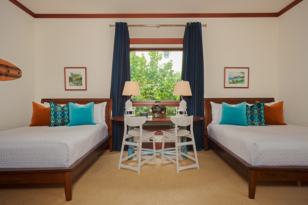 Kapalua Vacation Rentals, Ocean Dreams Villa 2203 at Montage Kapalua Bay* - Bedroom Three with 2 Full/Double Beds with Deluxe Mattresses, iPod Dock, CD/DVD, Leather Rocking/Reclining Chair, Drop-Down Play Table and Ottoman For Youngsters. Some games and books provided.