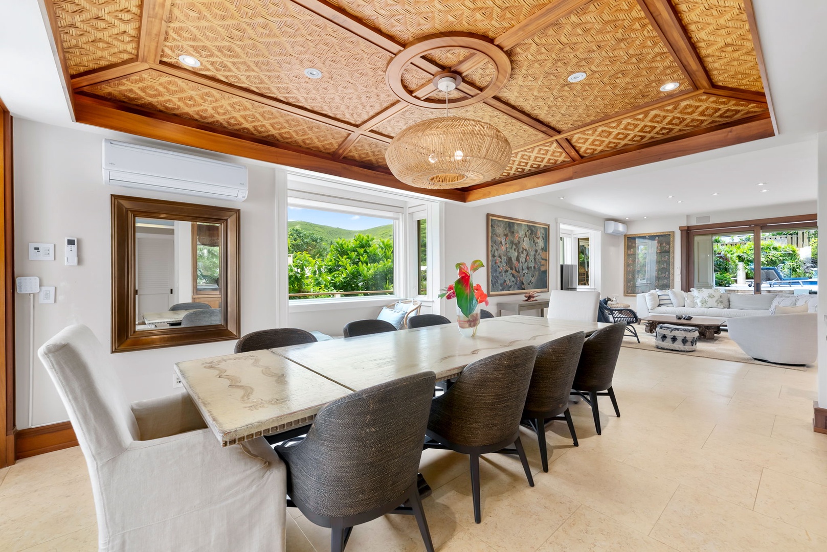 Kailua Vacation Rentals, Leaf House - Gather around this stunning dining table beneath a handcrafted woven ceiling, where natural light and lush garden views create your perfect setting for memorable meals together.