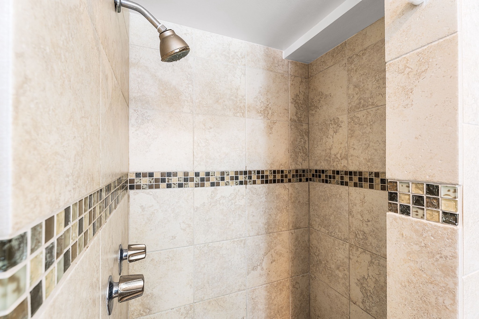 Kailua Kona Vacation Rentals, Sea Village 1105 - Walk-in tiled shower with accent trim provides a refreshing rinse after beach days.