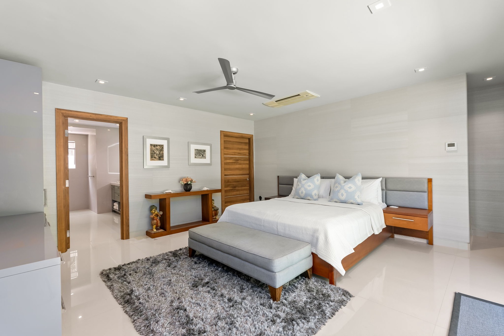 Honolulu Vacation Rentals, Diamond Head Beachfront Estate - Drift off in this serene bedroom, where soft linens, modern style, and thoughtful touches create your peaceful retreat after a day of adventure.