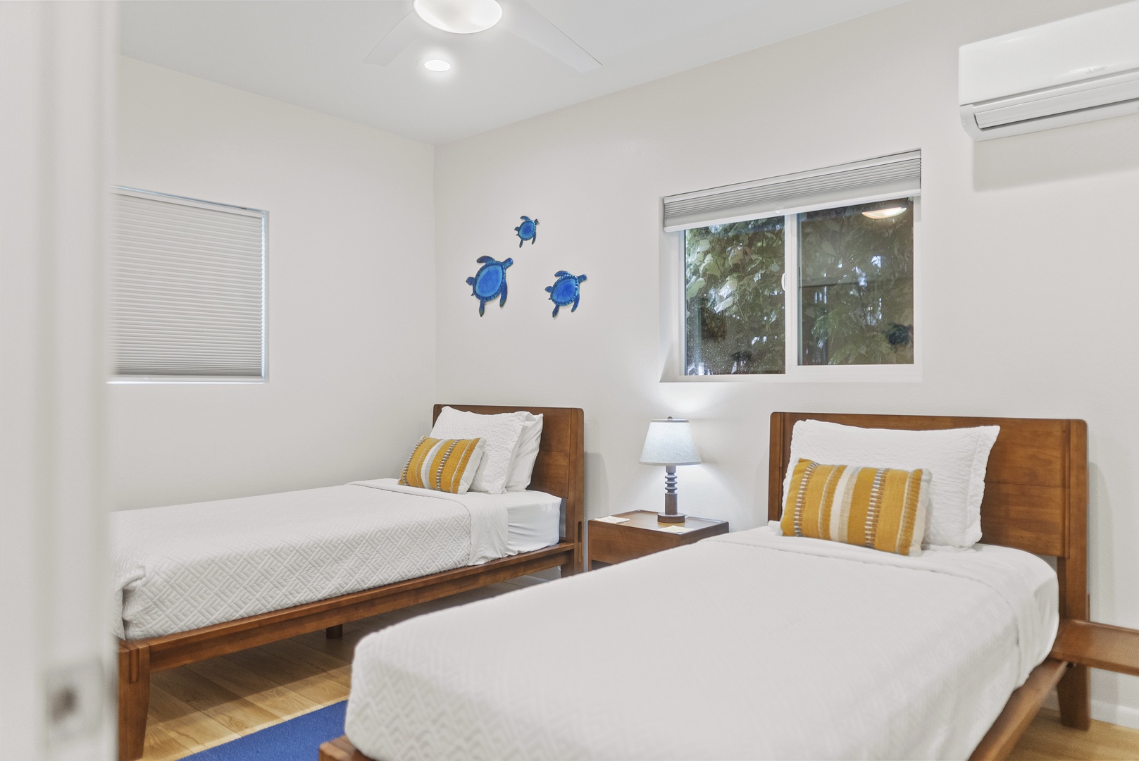 Haleiwa Vacation Rentals, Surfer's Paradise - Bright twin bedroom with coastal accents—perfect for kids or friends, complete with A/C and plenty of natural light.