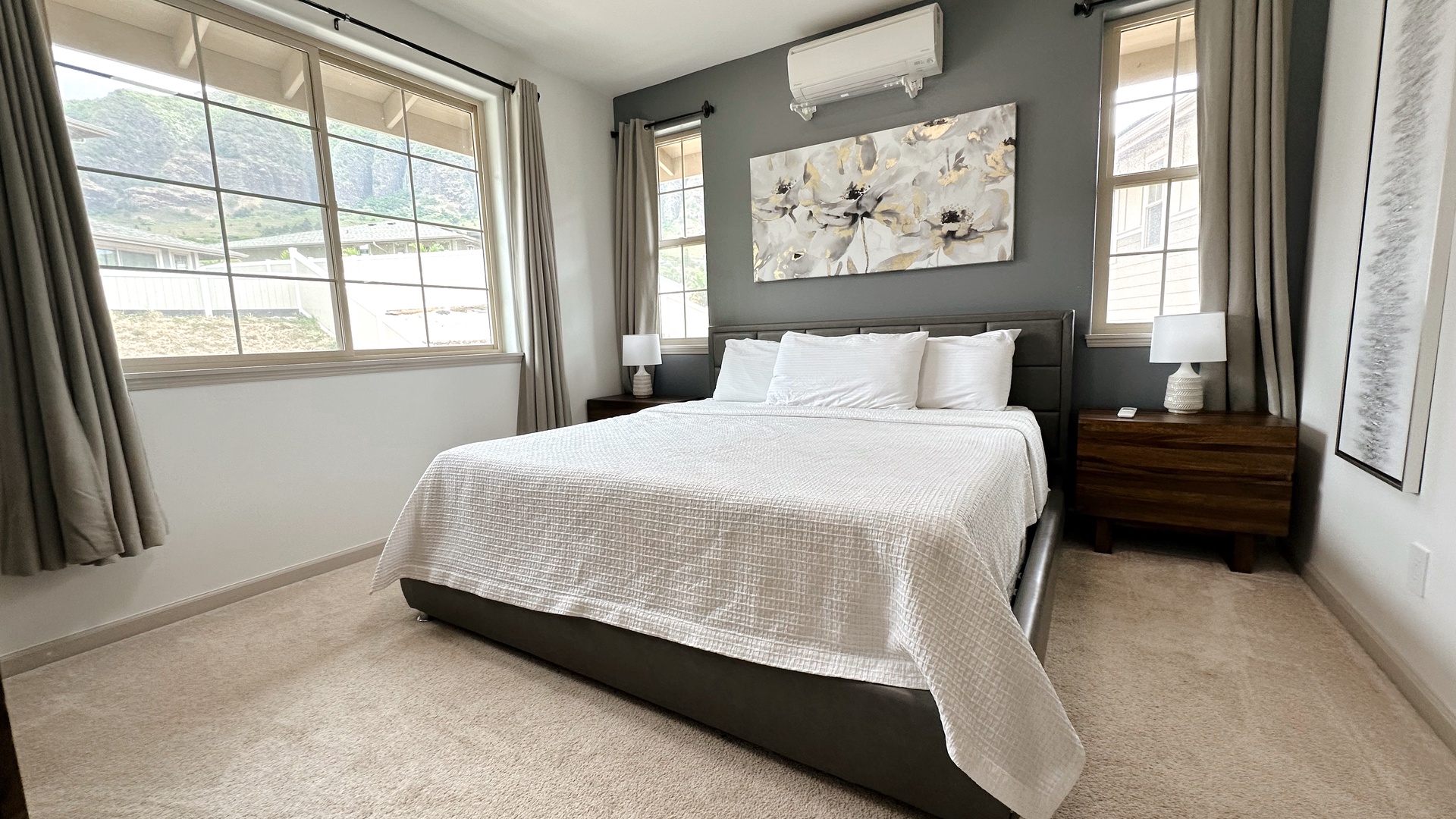 Makaha Valley Vacation Rentals, Makaha Valley Hale Kai** - Elegant bedroom with plush bedding and natural light streaming in.