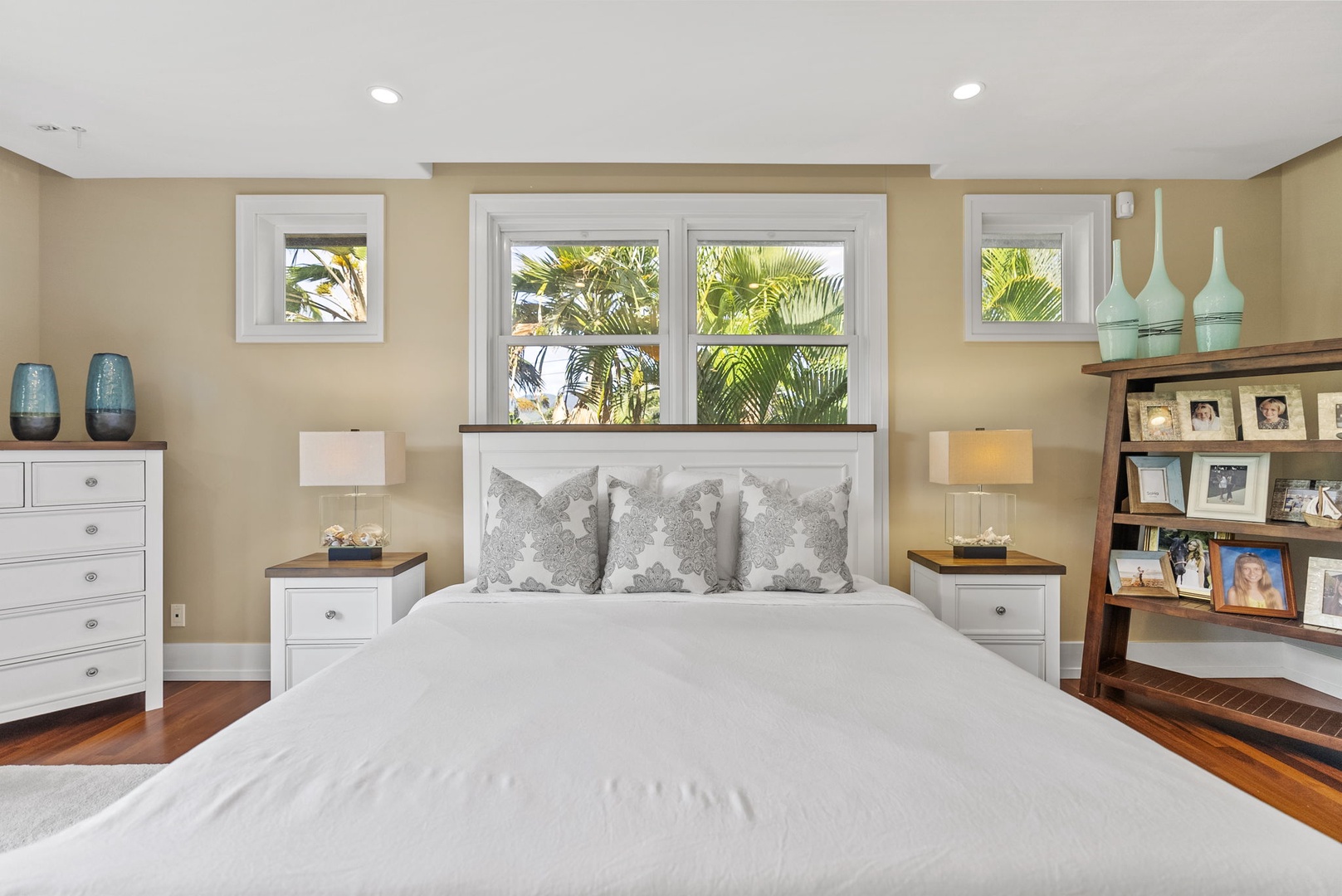 Honolulu Vacation Rentals, Pili Pono - Bedroom with a queen-size bed and natural lighting.