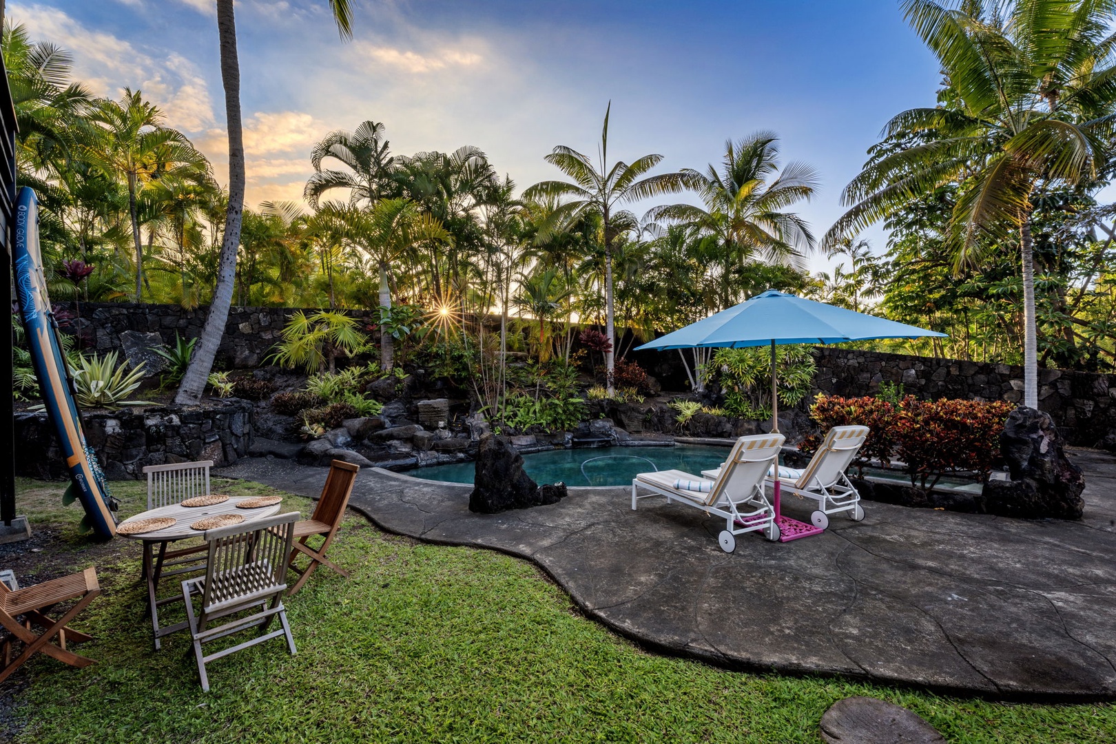 Kailua Kona Vacation Rentals, Mai Tai Manor - Your private tropical oasis awaits with a sparkling pool surrounded by swaying palms and comfortable lounge chairs for endless relaxation.