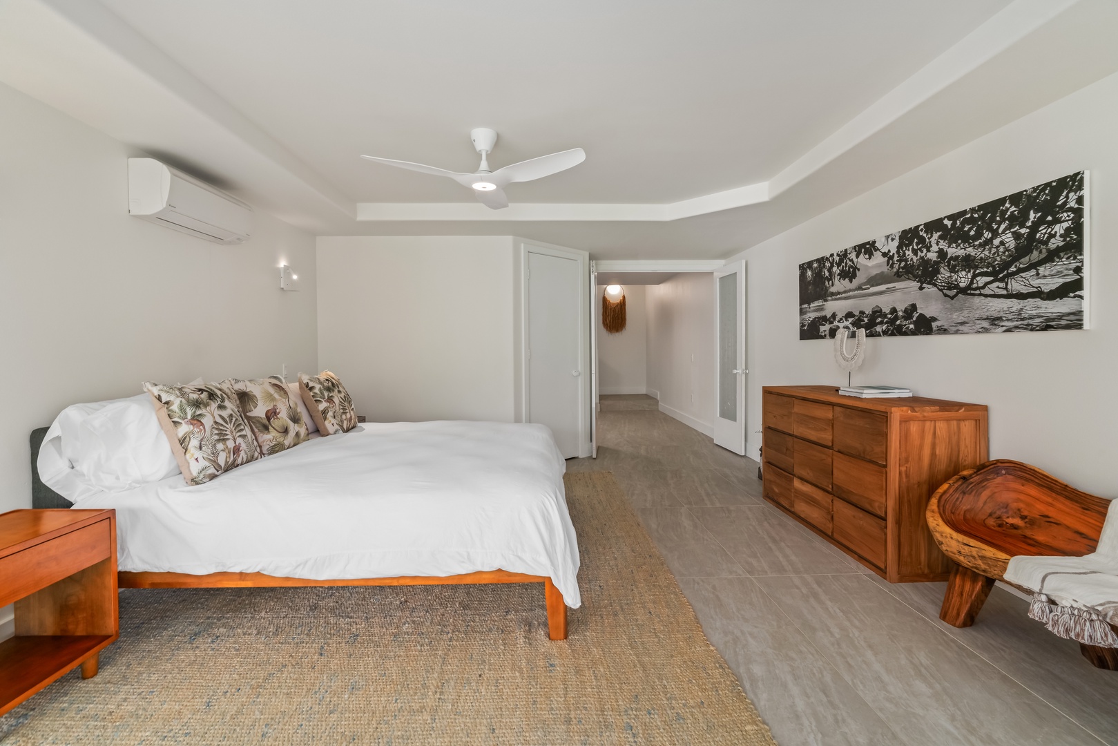 Princeville Vacation Rentals, Mana Wahine - King bed and custom art elevate this peaceful, light-filled bedroom.