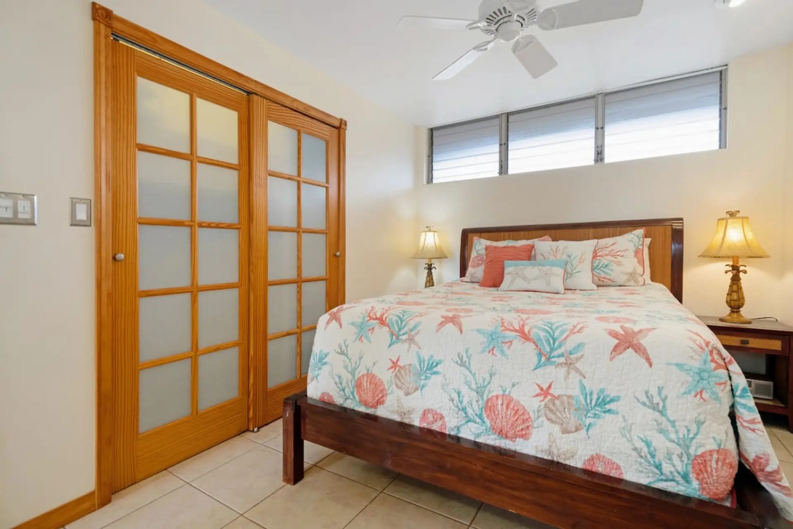 Kihei Vacation Rentals, Kalama Terrace P302 - Neither side of the bed goes dark first, with a lamp lit on each nightstand.