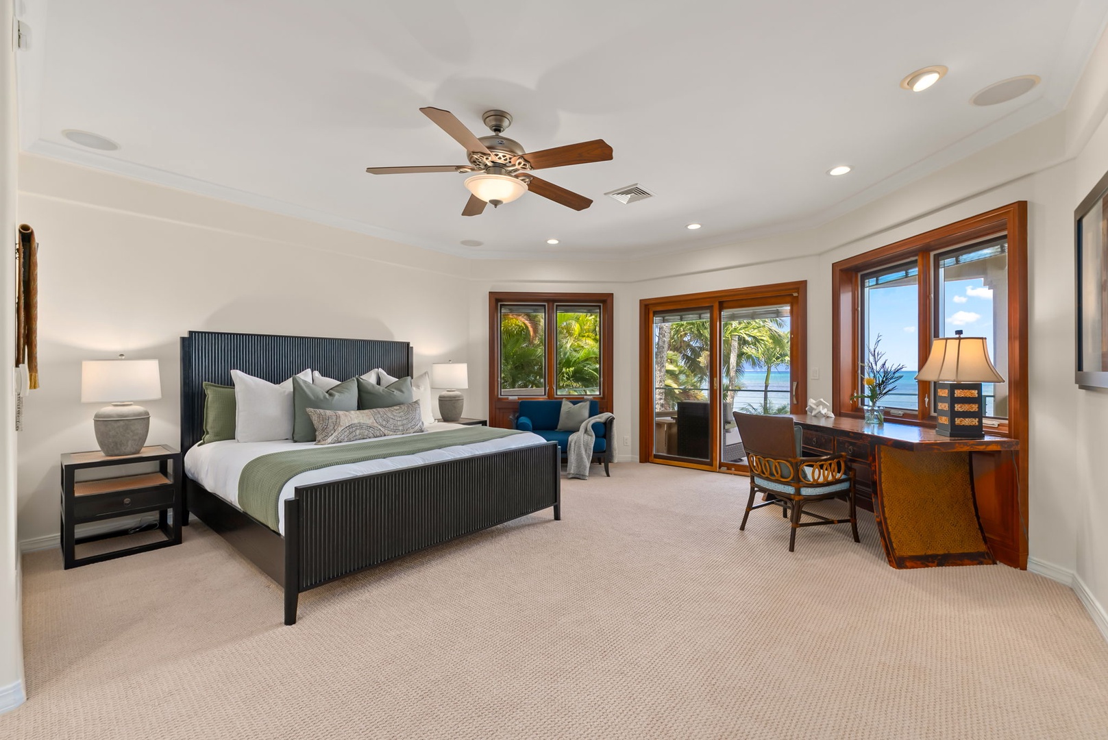 Honolulu Vacation Rentals, Maunalua Estate - Plush bedding, warm wood accents, and sweeping ocean views create a calm coastal retreat.